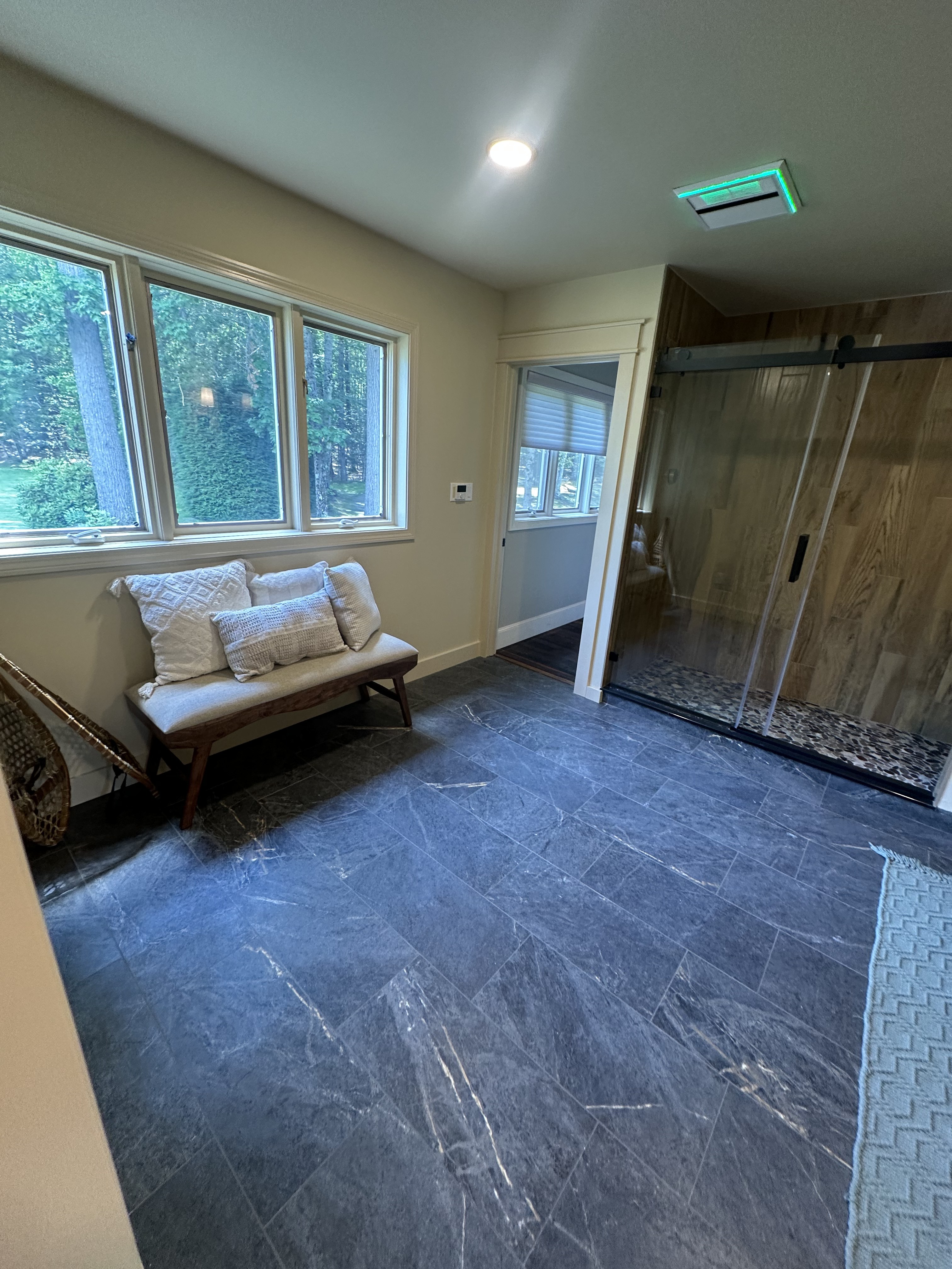 Spa bathroom with stone tile & barn door