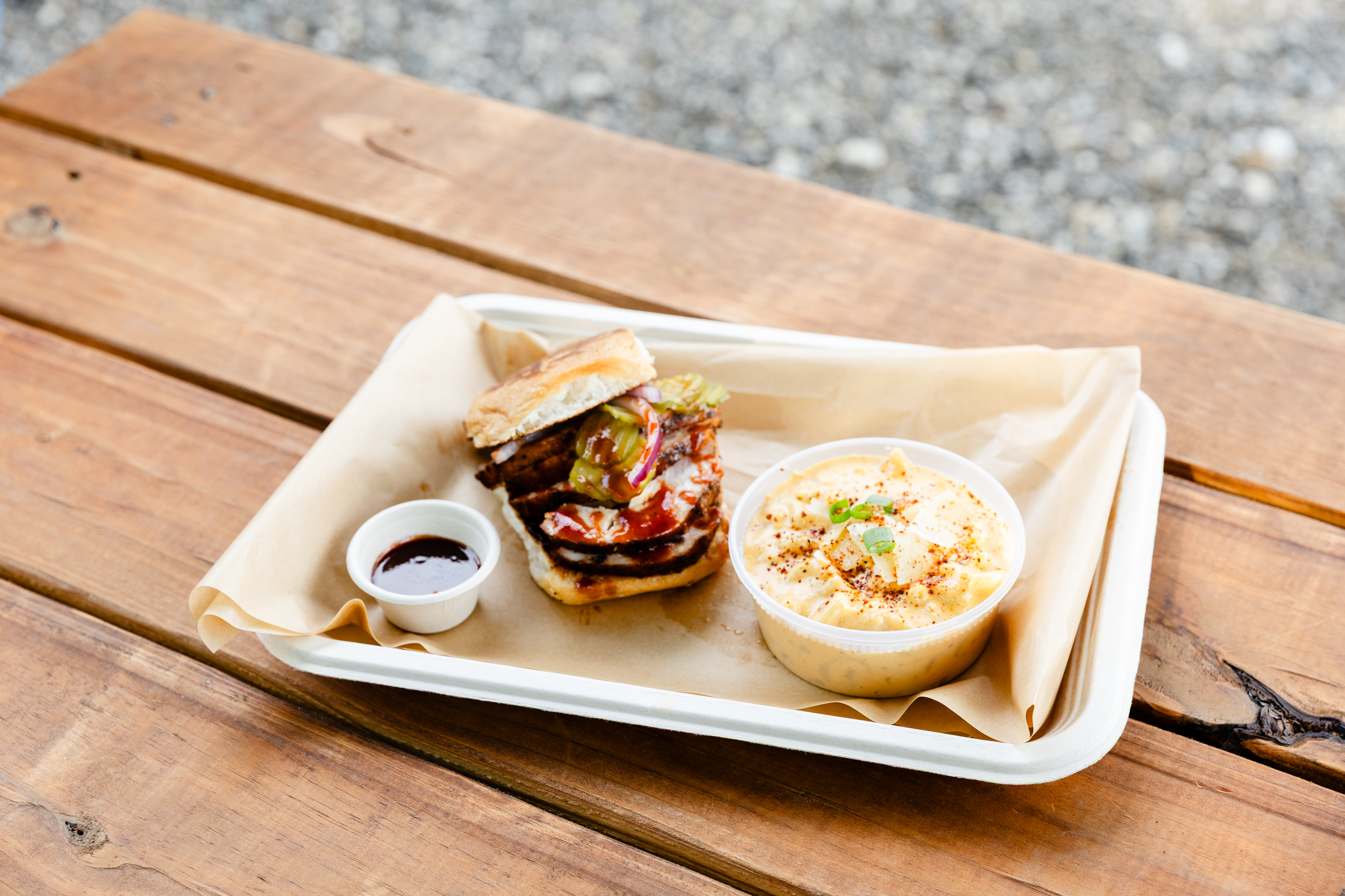 BARK'D BBQ smash burger with beef bacon, cheese, pickles and coleslaw