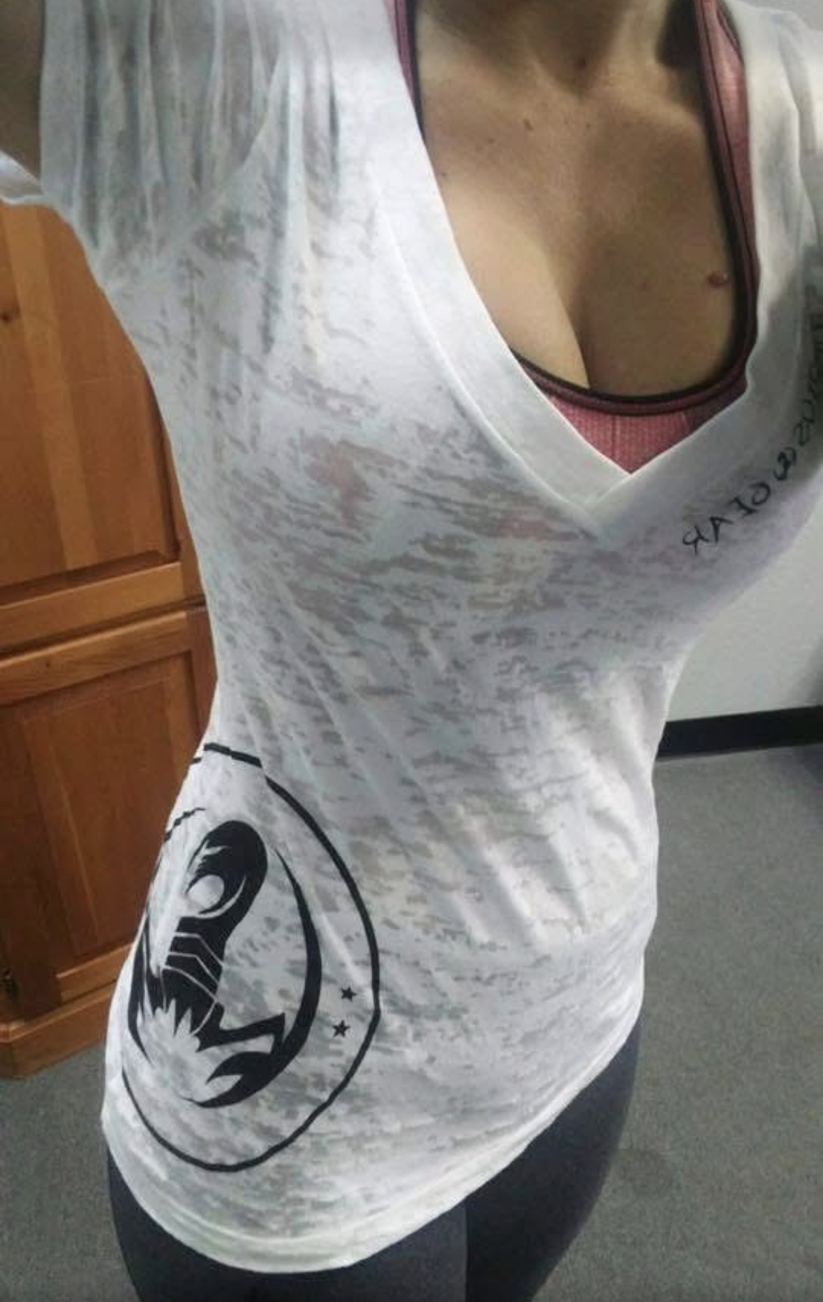 White distressed tee. SCORPIUS down the sleeve, scorpion at the hip.