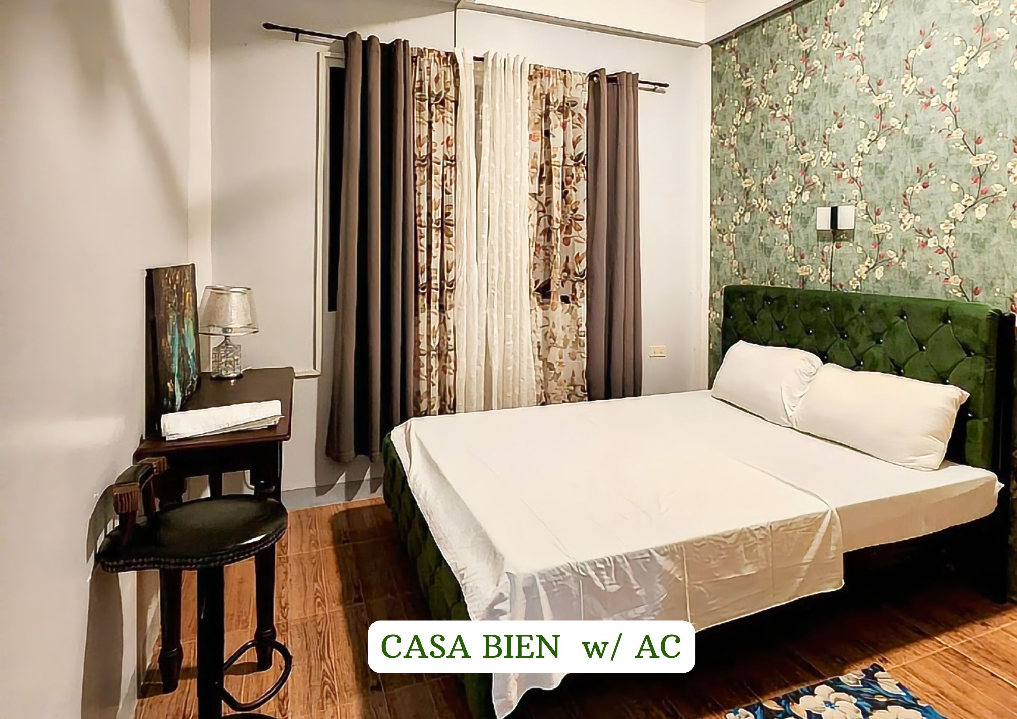 Casa Bien w/ AC — queen bed with floral wallpaper at The Oasis private resort Bicol