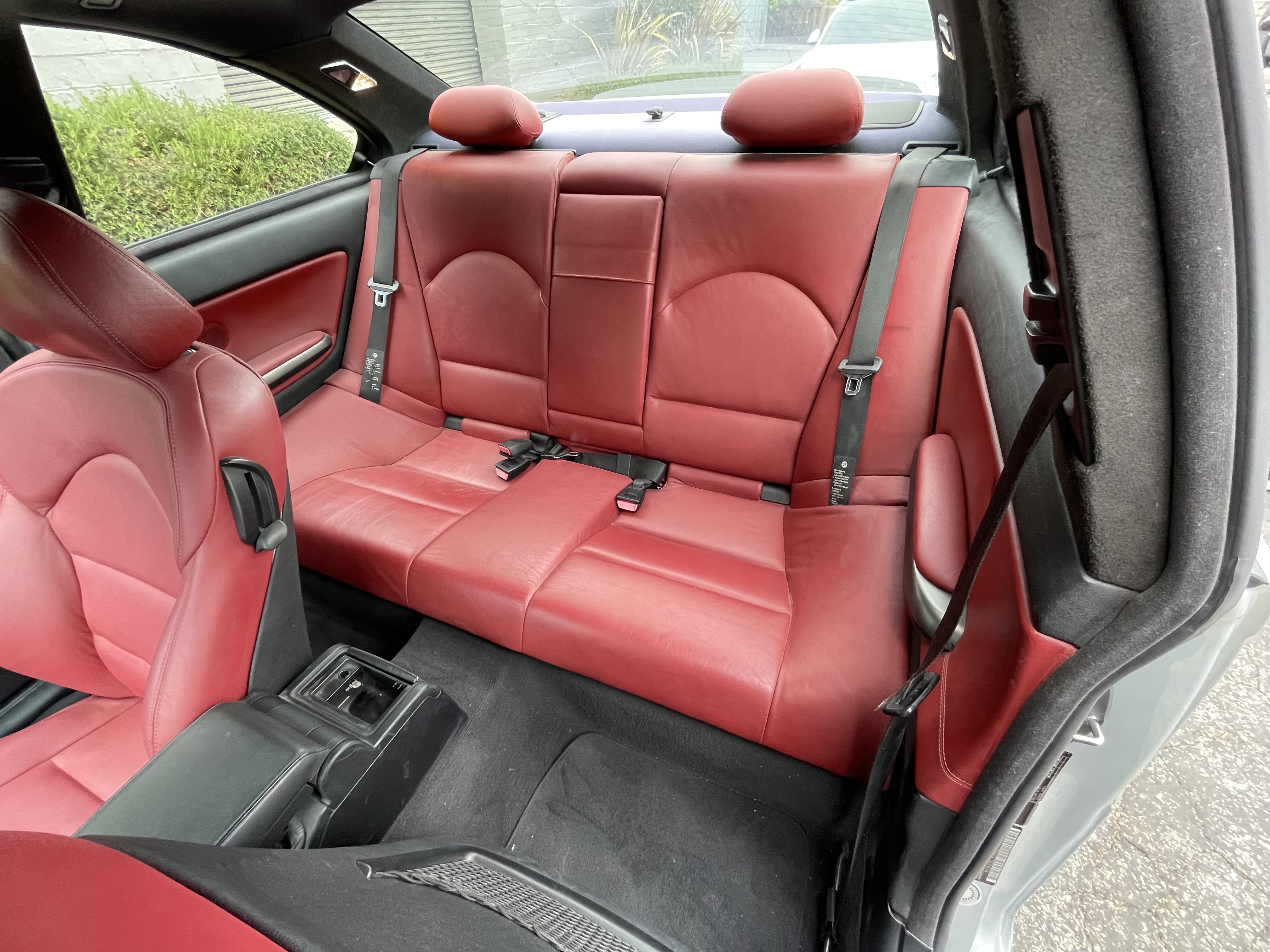 BMW M3 rear seat interior detailing - conditioned red leather