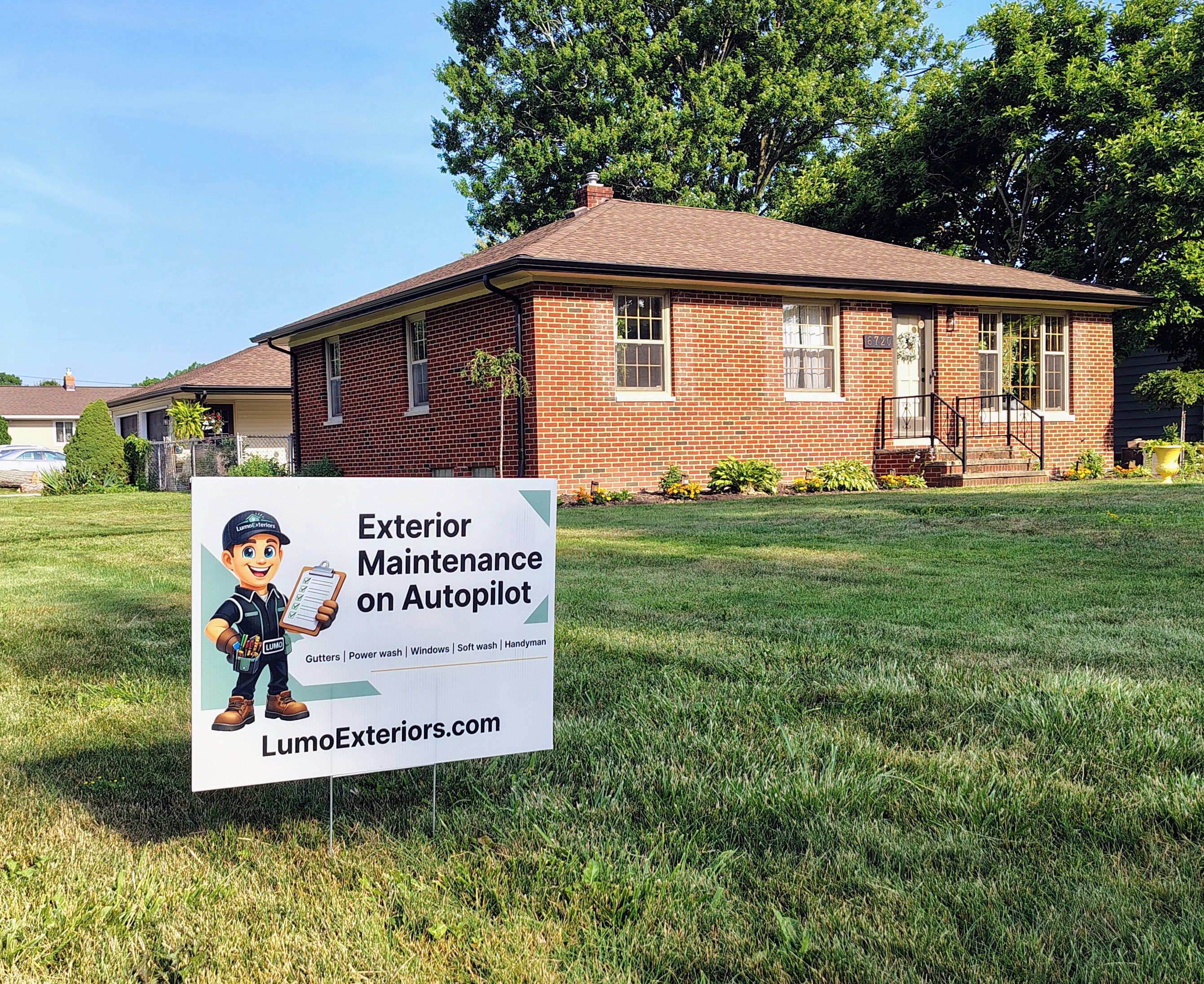 LumoExteriors yard sign in front of a brick ranch home in Greater Cleveland