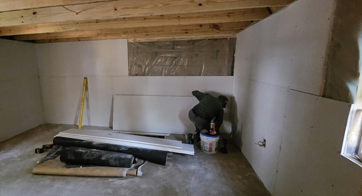 TeamGo crew installing drywall
