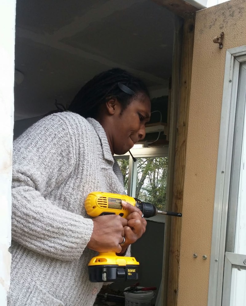 LeTava doing door frame carpentry work