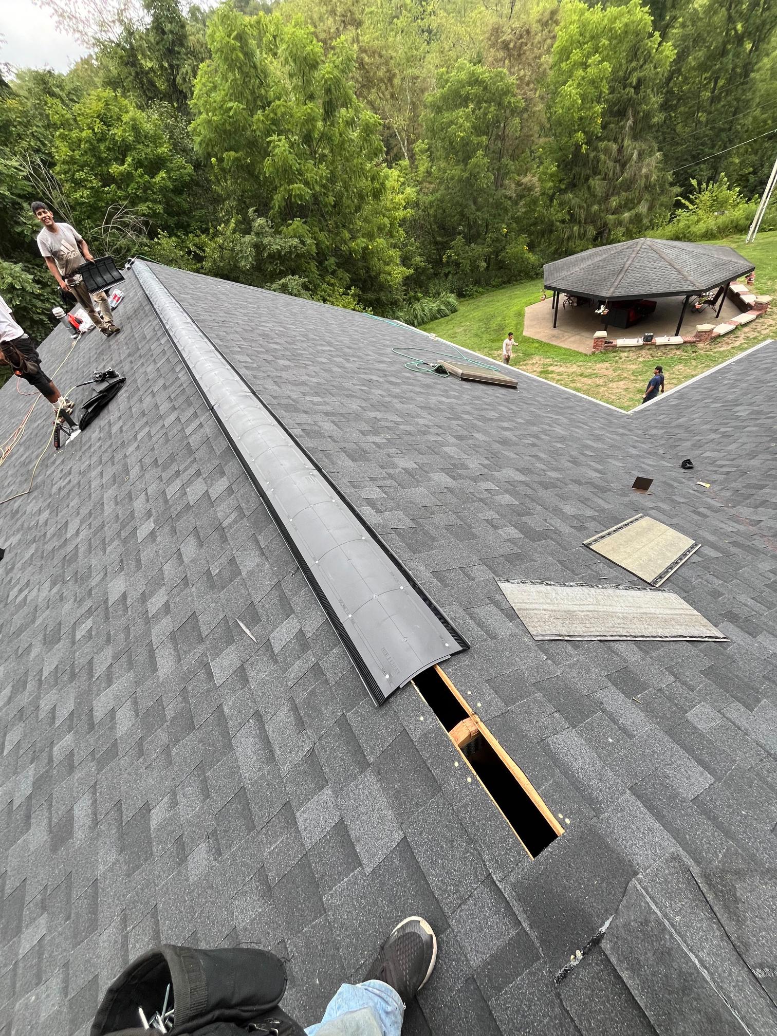 Del Cid Construction crew installing new shingle roof Pittsburgh PA