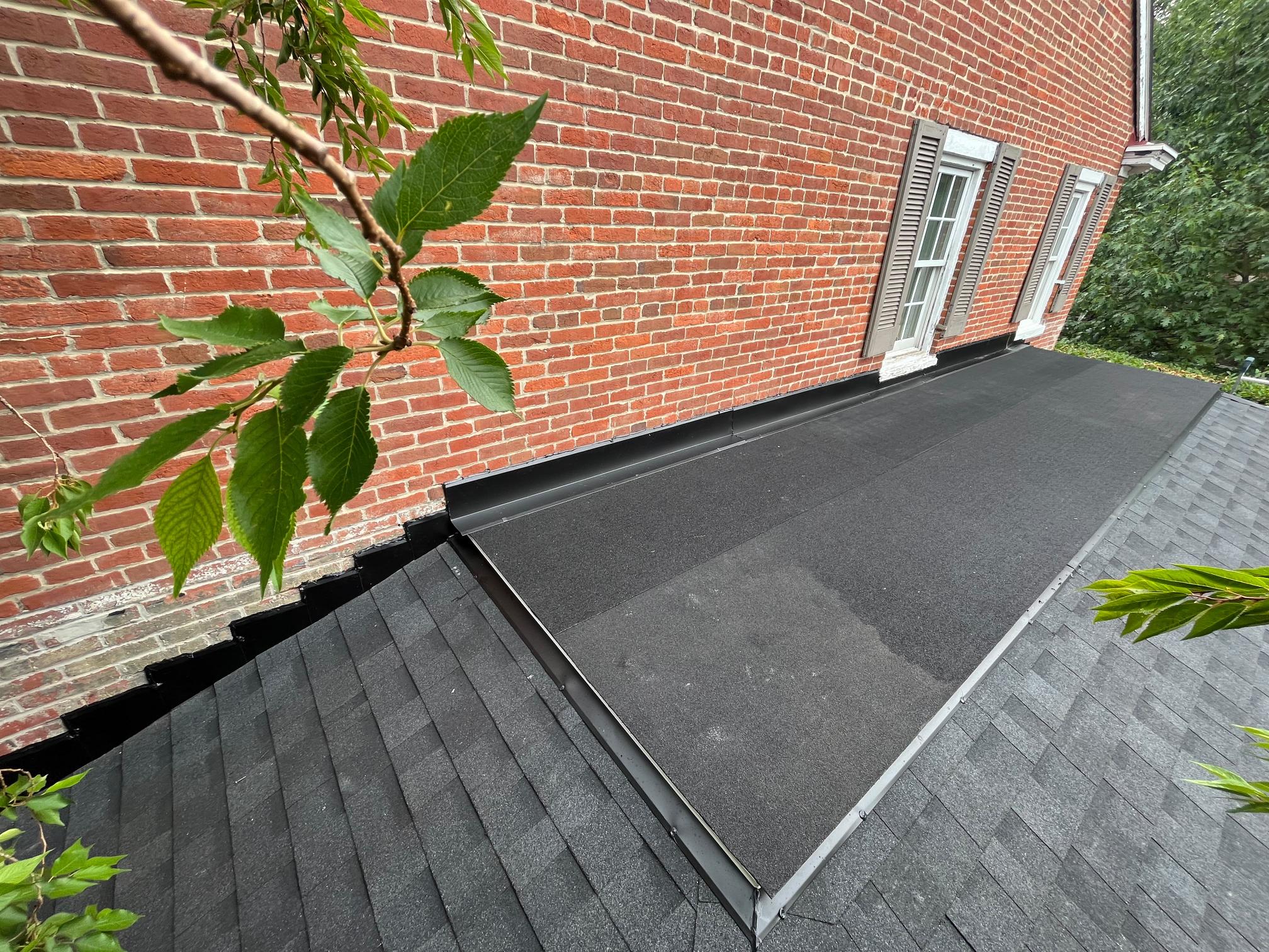 Completed flat roof with shingles on brick building Pittsburgh PA