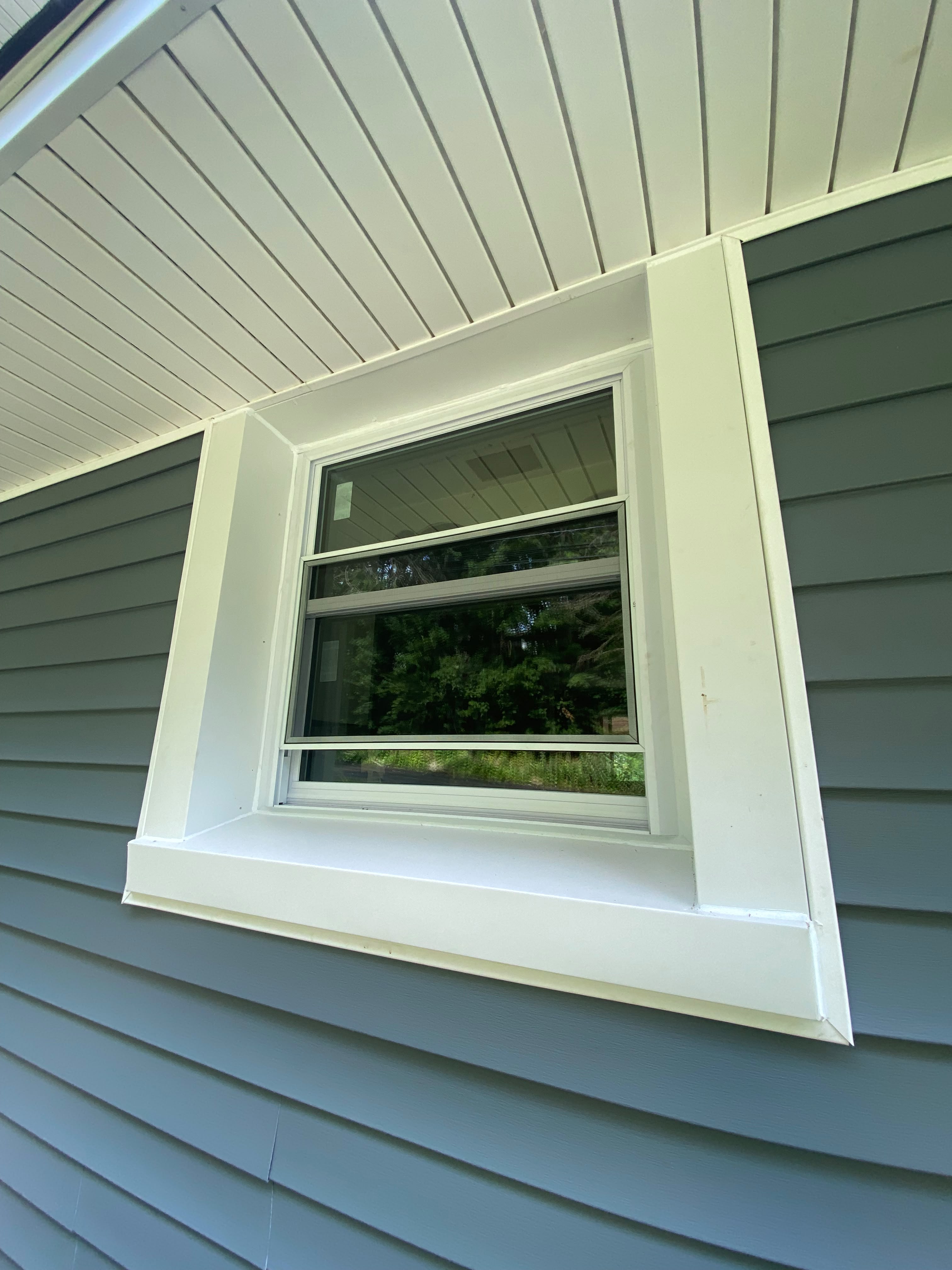 Completed siding and soffit with clean window trim Pittsburgh PA