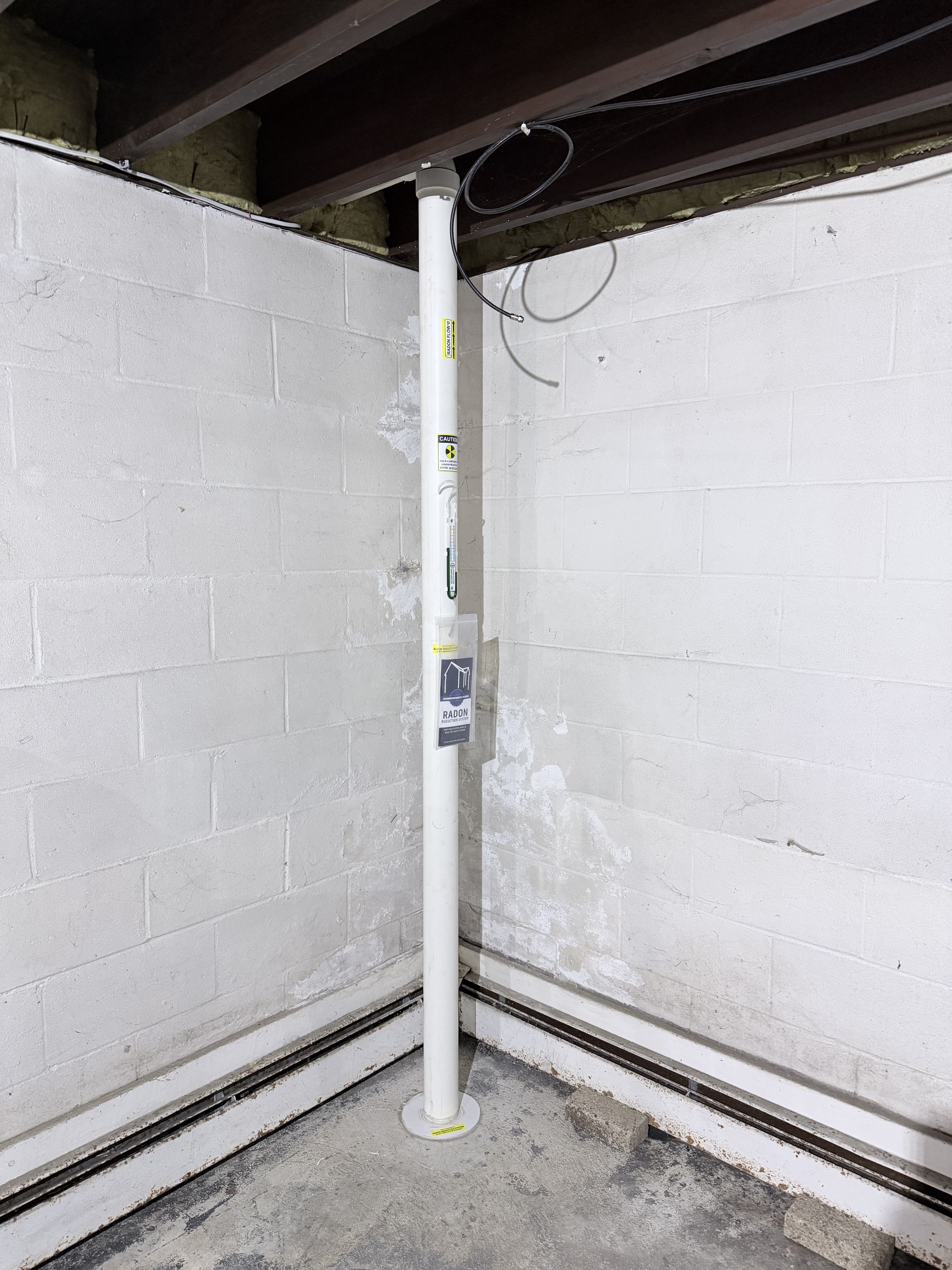 Completed radon mitigation system installation