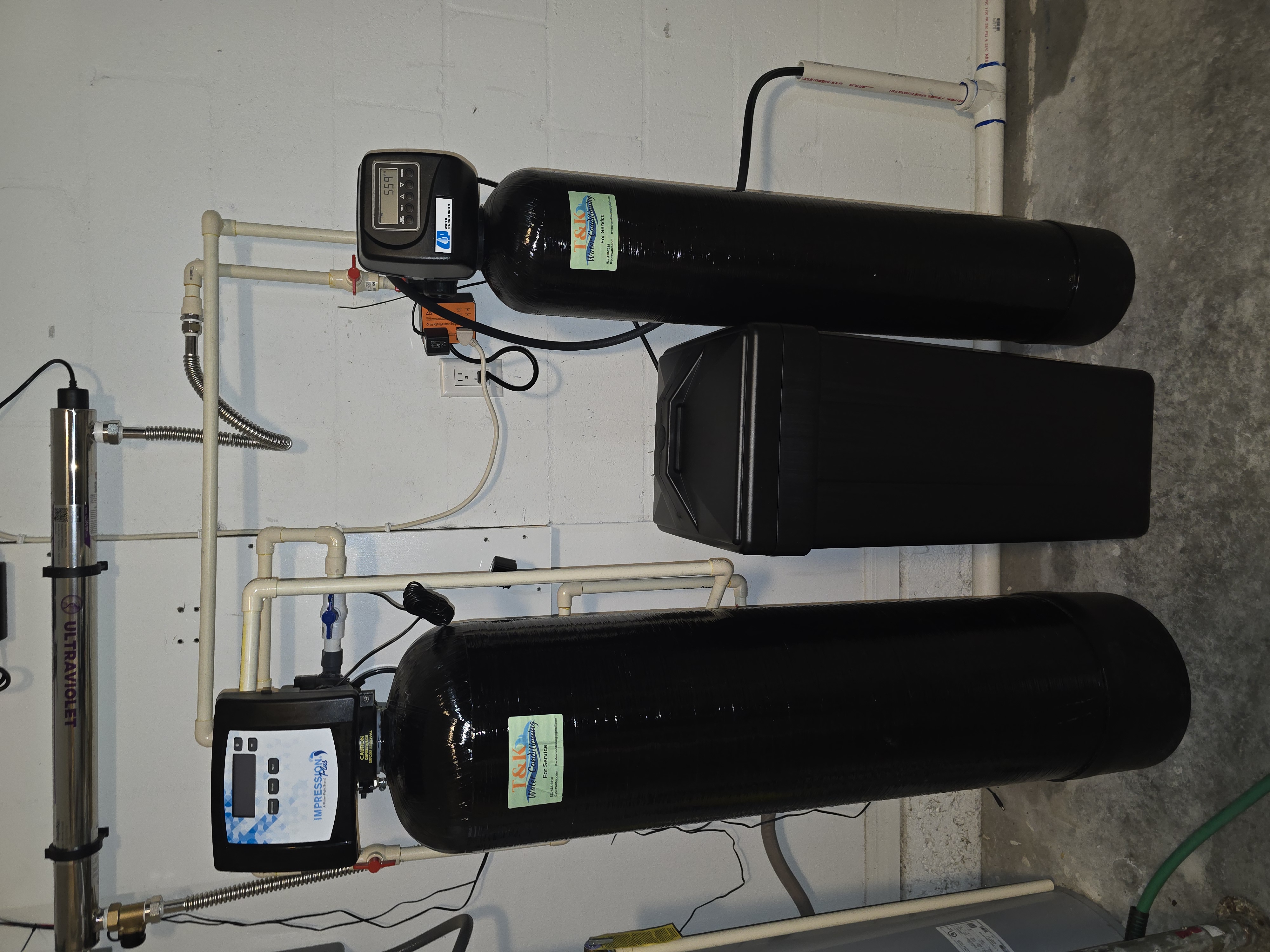 T&K dual-tank system with Impression Plus softener, iron filter, and UV ultraviolet purification light
