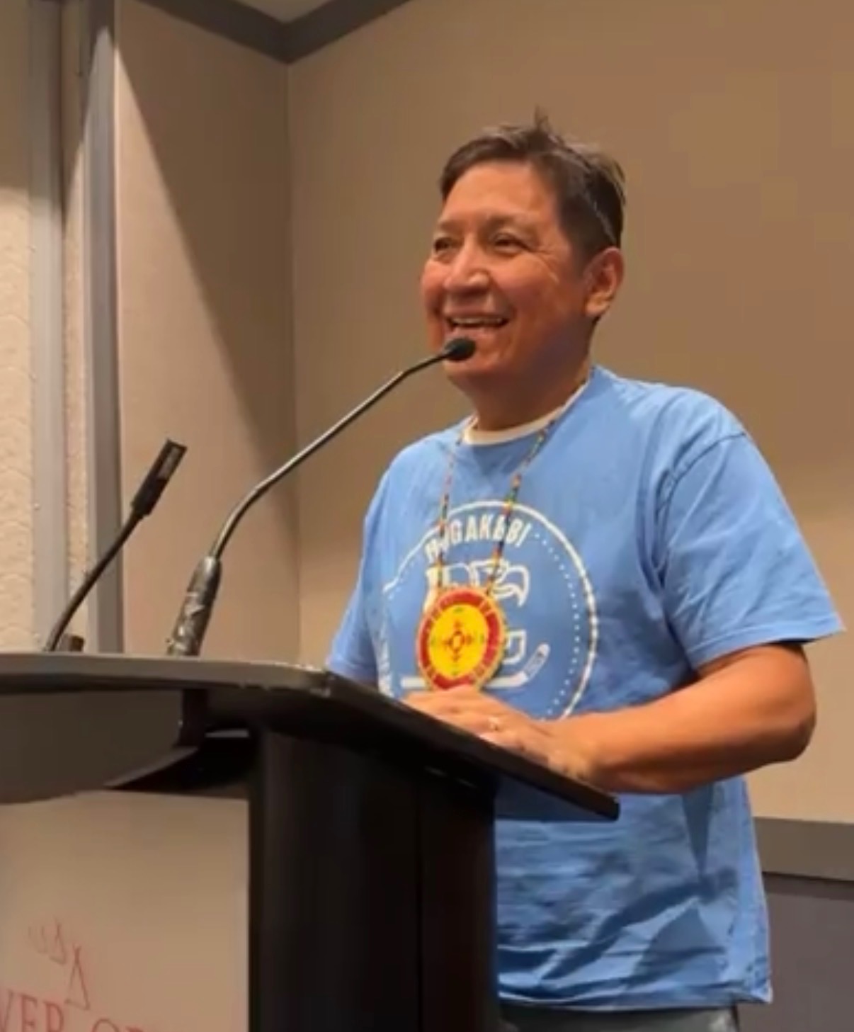 Chief Reg Cardinal speaking at podium