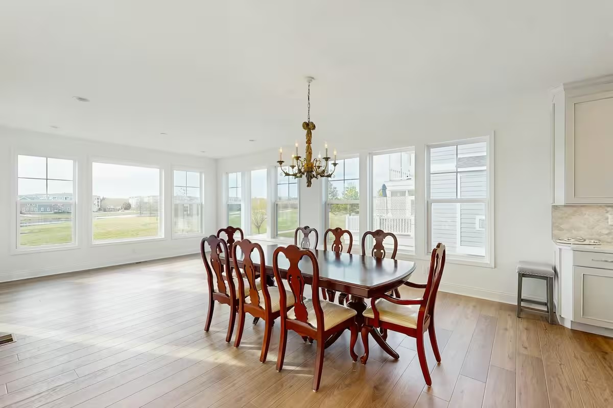 Elegant dining room with chandelier mahogany table and bay views