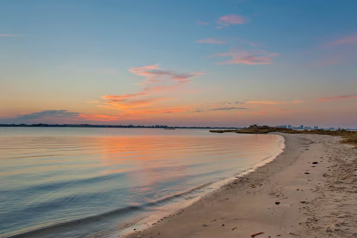 Stunning sunset over the bay with pink and orange sky