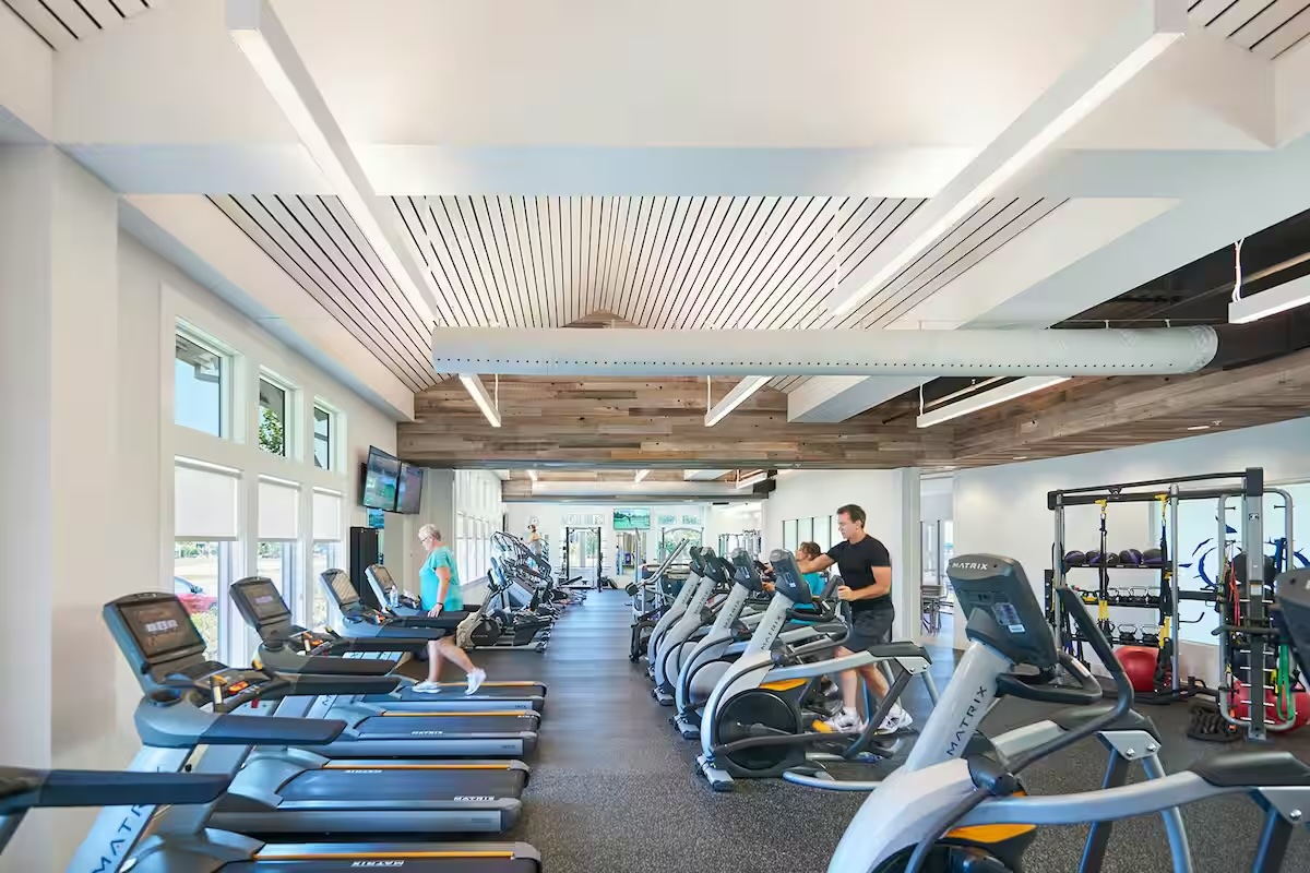 Full fitness center with treadmills and weight equipment