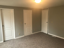 Interior painting - freshly painted bedroom with clean trim and neutral tones