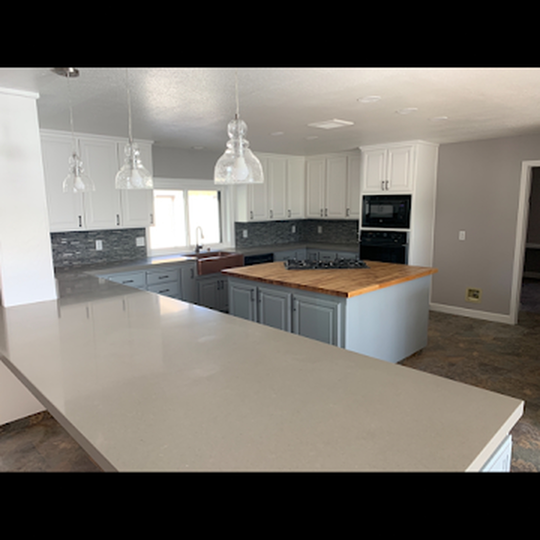 Cabinet refinishing - white uppers and gray-blue lowers with quartz countertops