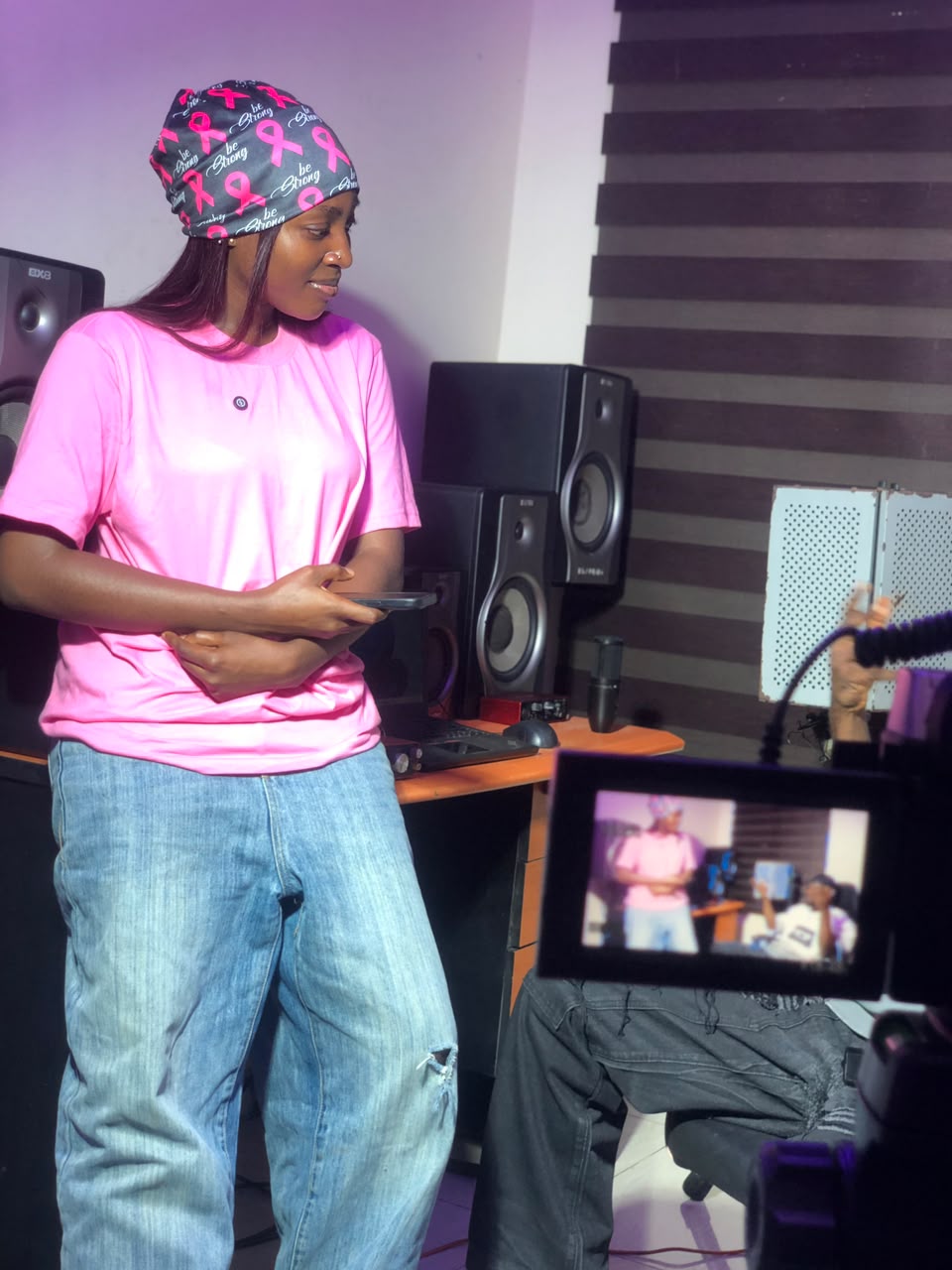 R Visionz Africa episode — host in the studio preparing for an interview