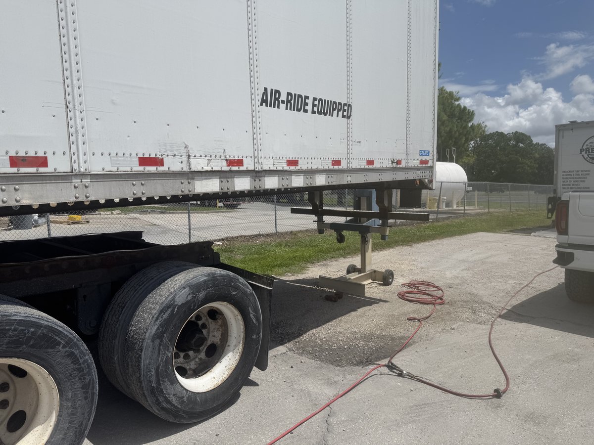 Air-ride equipped trailer under repair