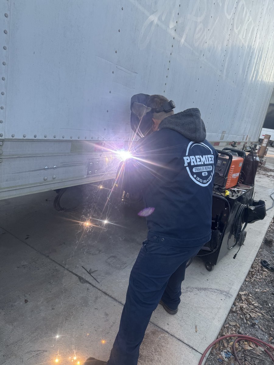 Premier Trailer Repair technician welding on-site
