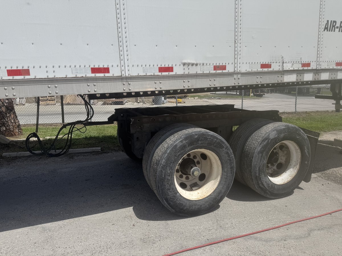 Semi-trailer wheel and suspension repair in progress