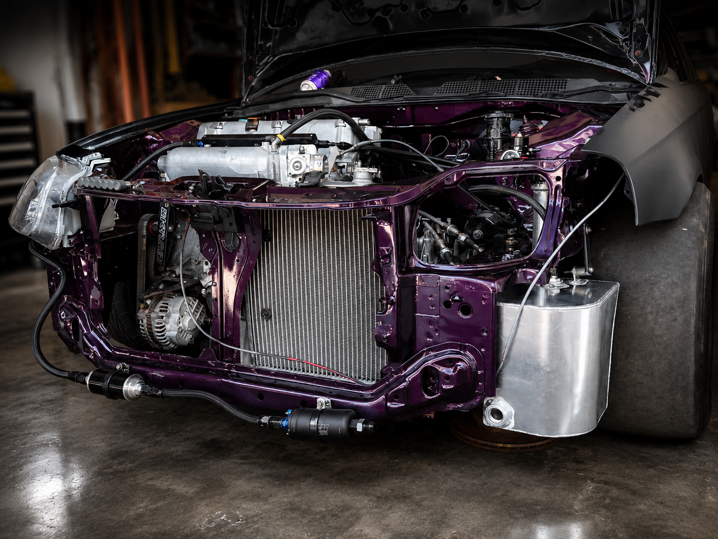 Purple engine bay build with radiator and custom plumbing at J&J Imports