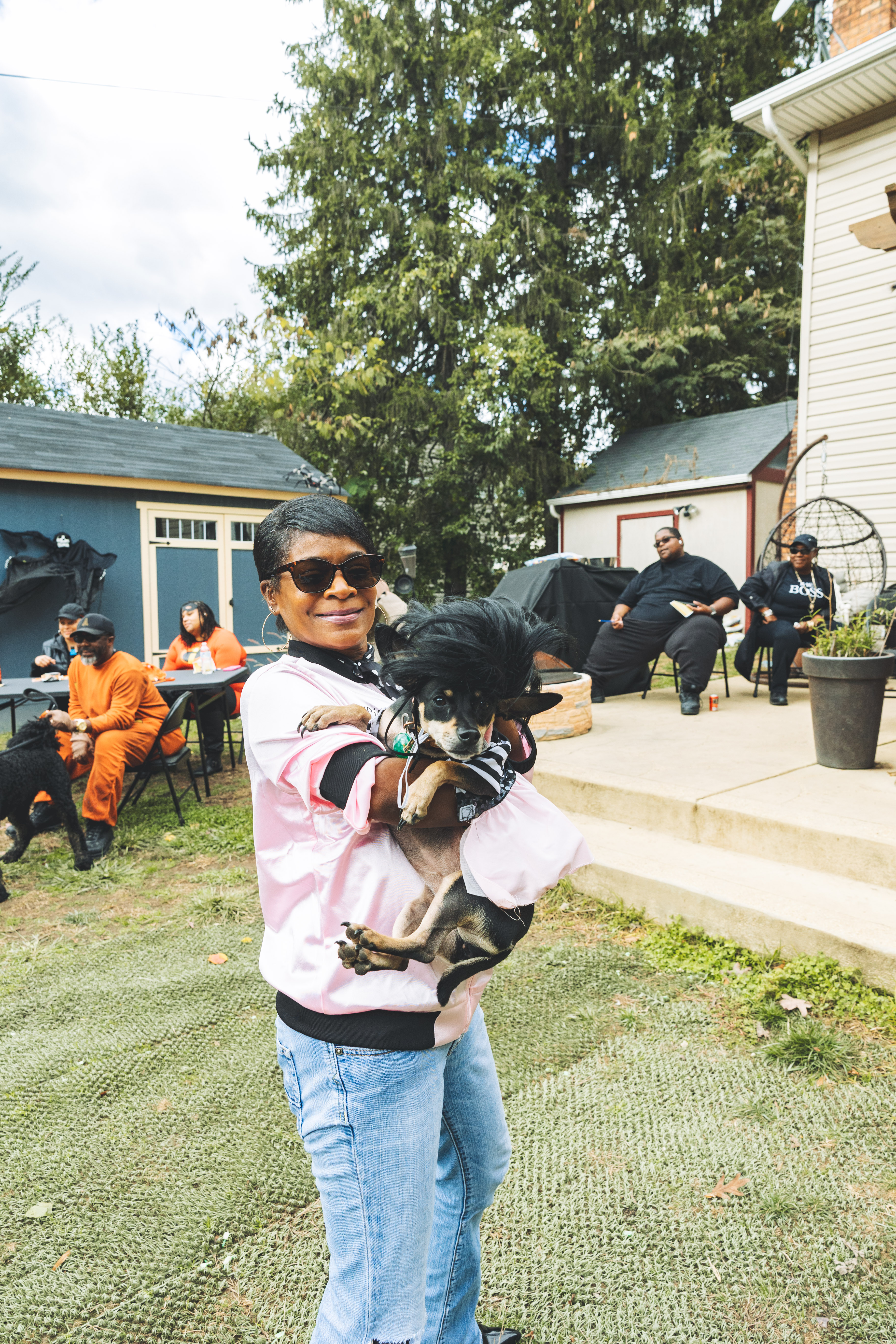 Pet parent holding her pup at event