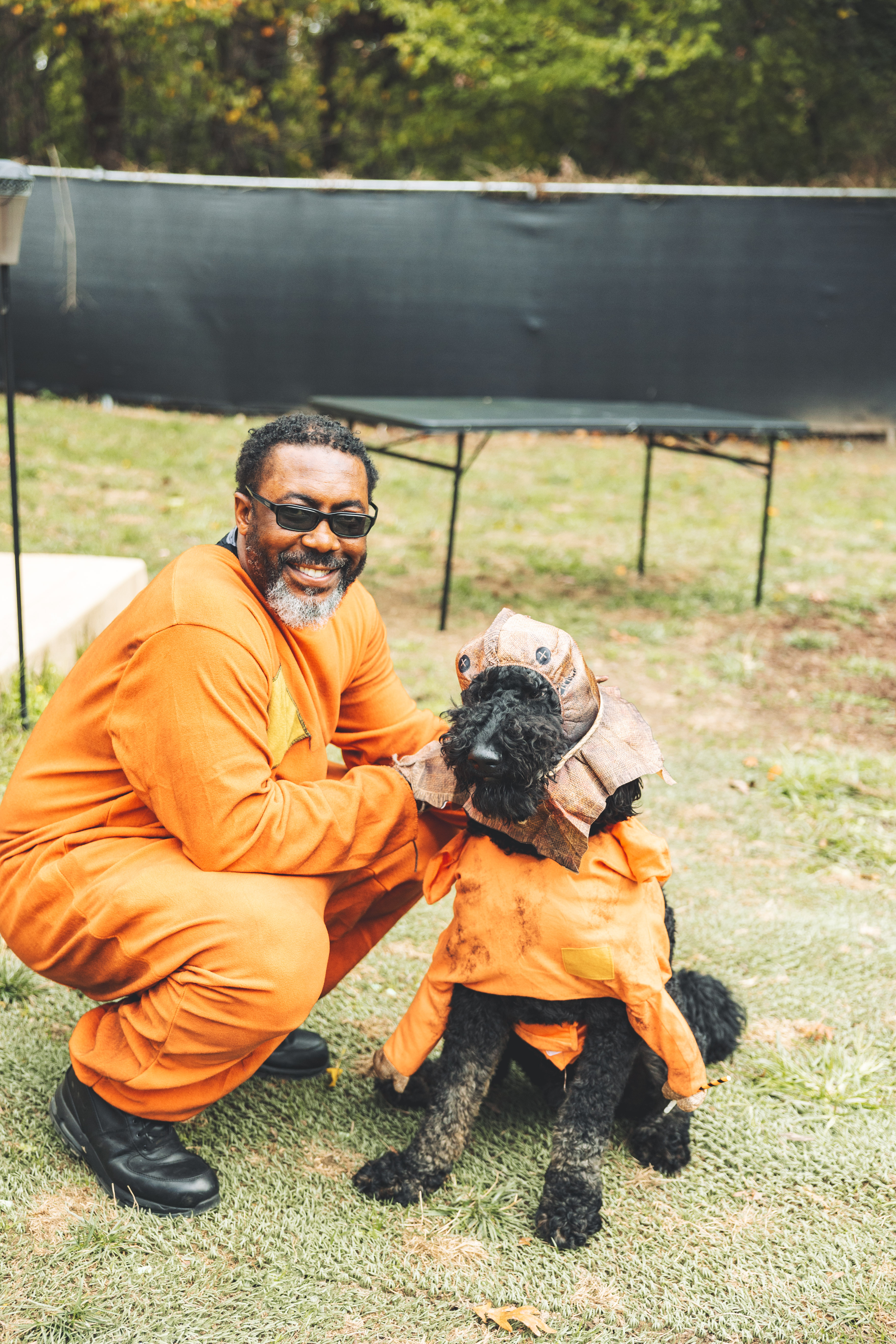 Pet parent and dog in matching costumes