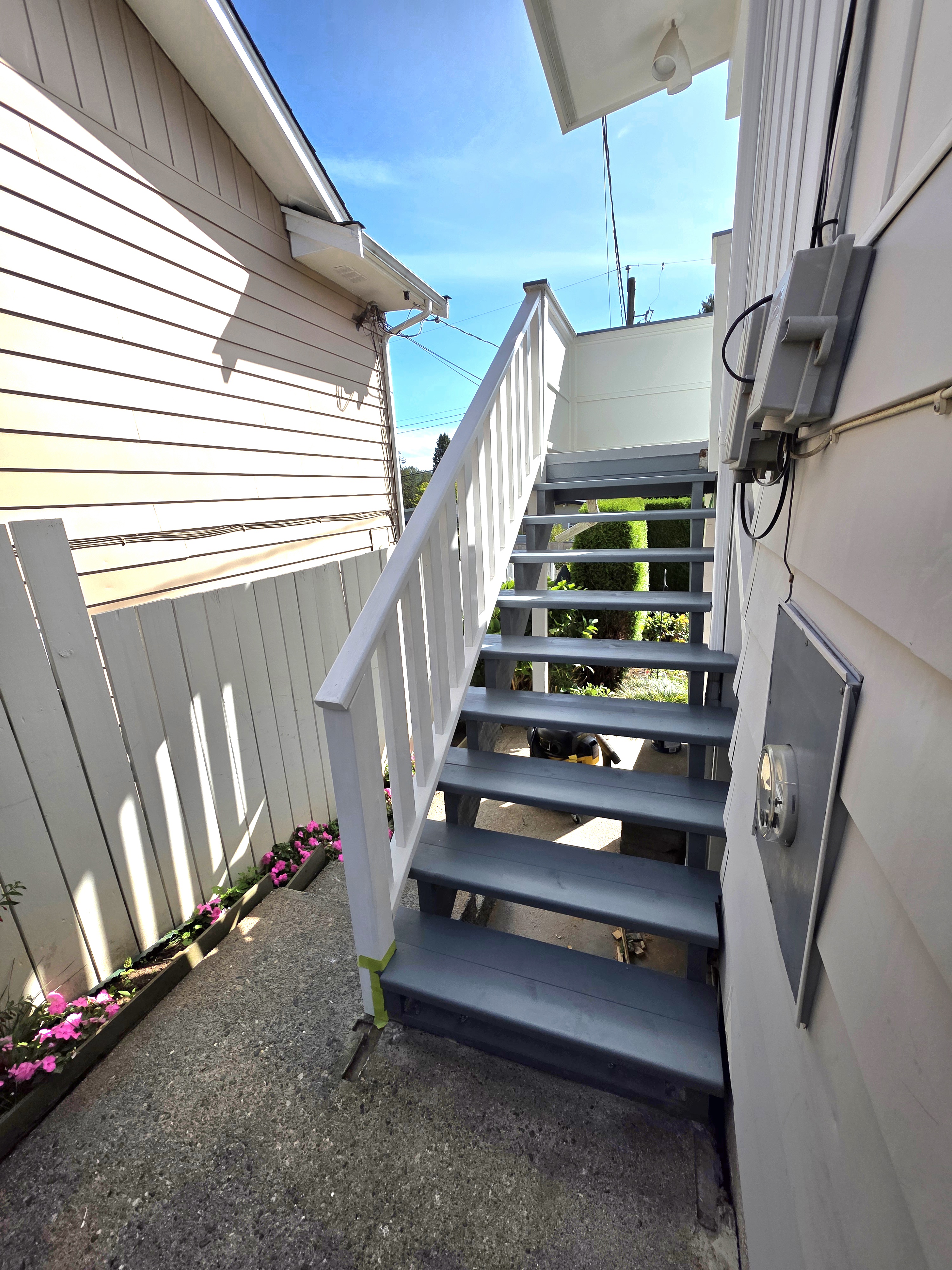 Nester's completed outdoor stairs painted grey by Tarak Construction