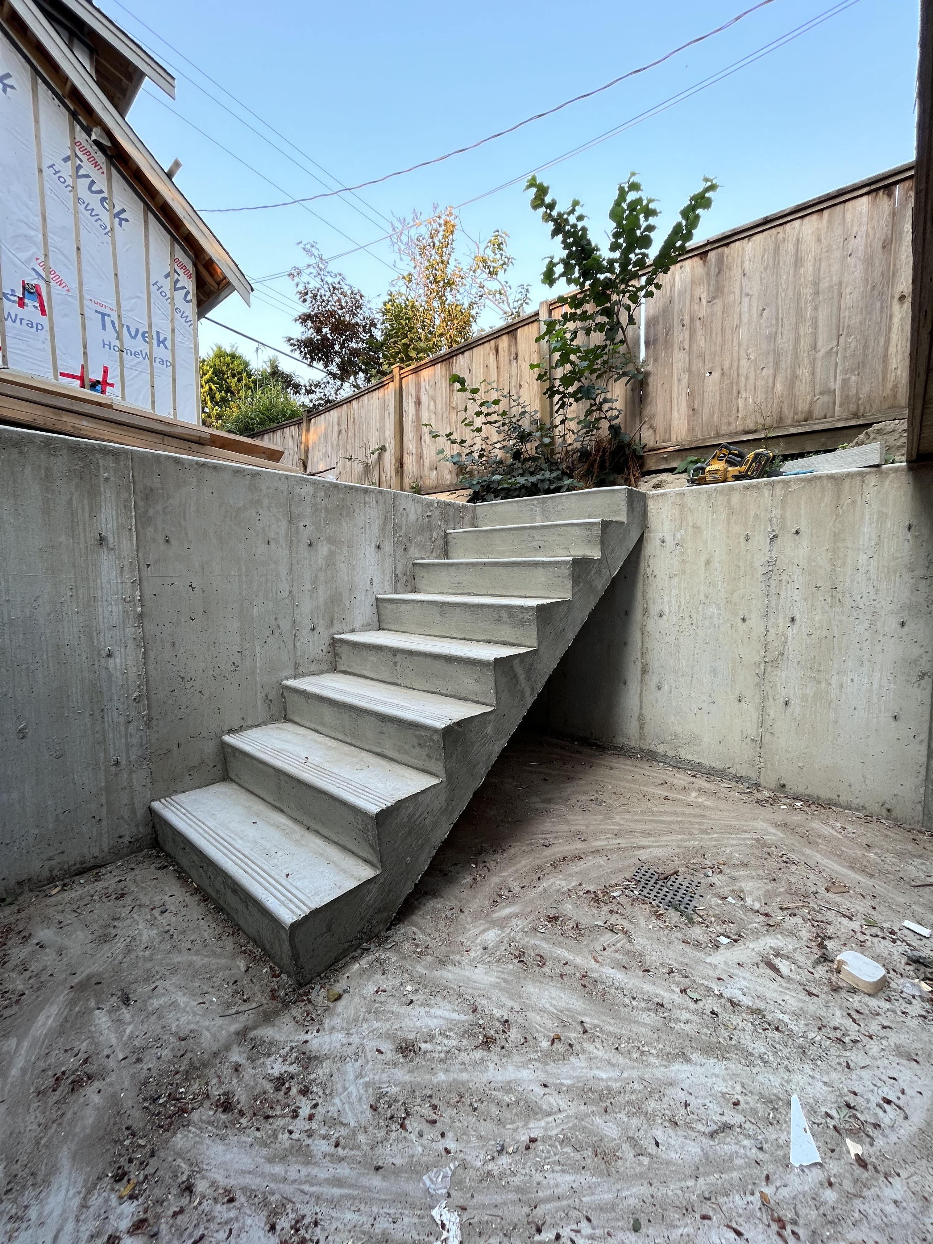 Tony's concrete basement access stairs on new home build by Tarak Construction