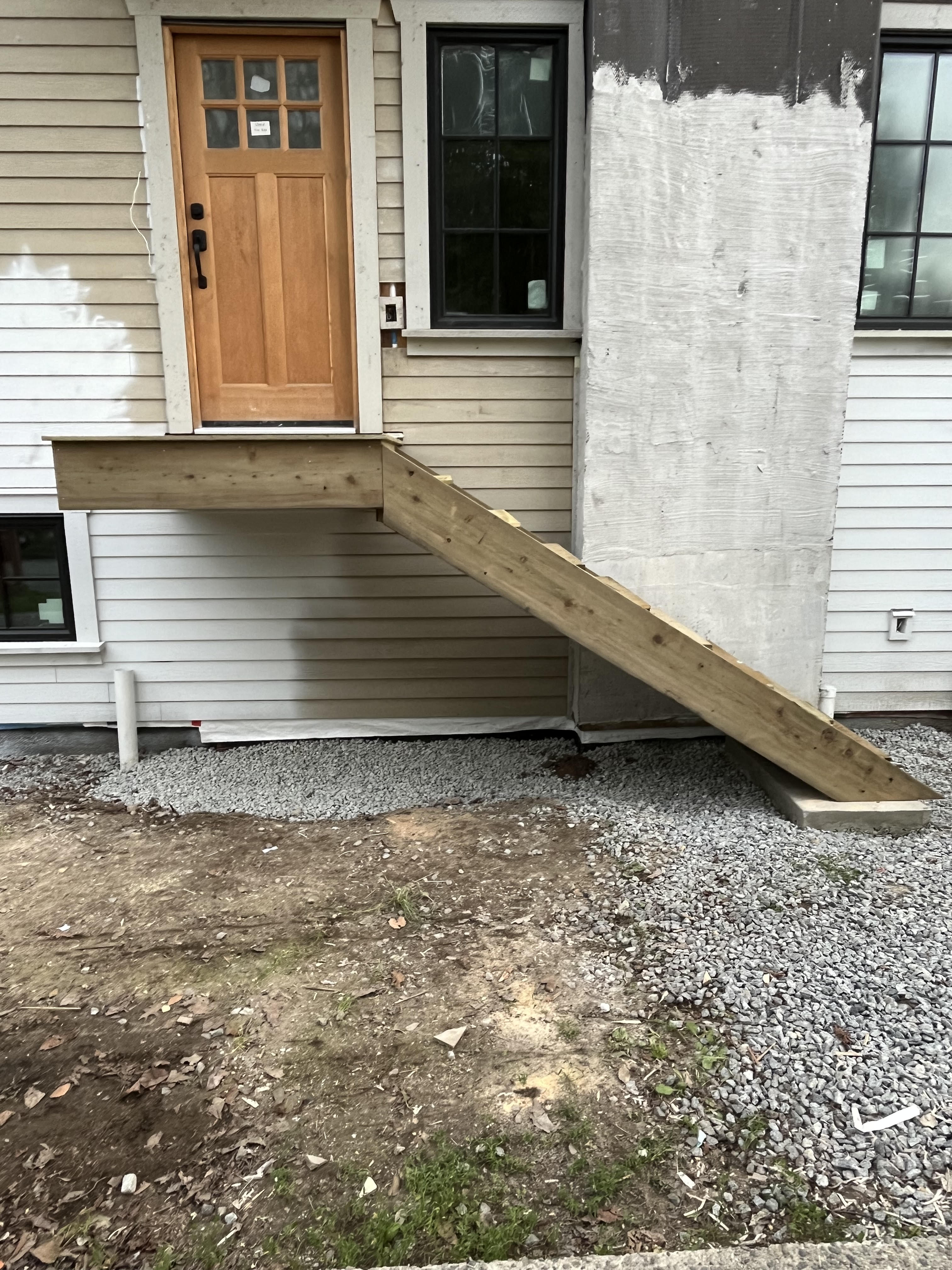 Michelle's landing at the top of the side entrance stairs by Tarak Construction