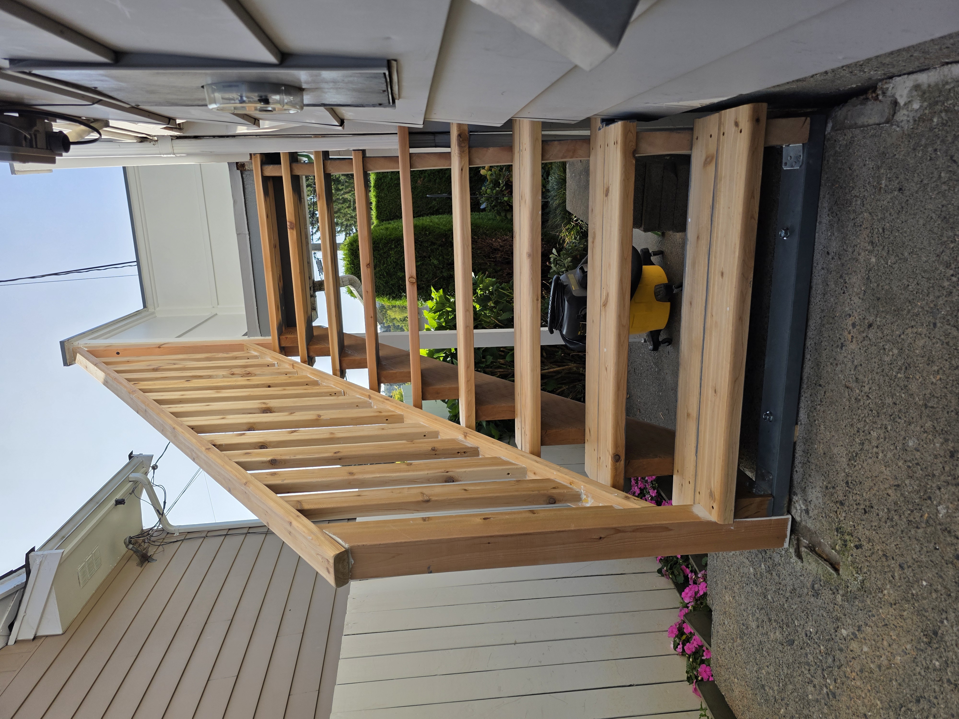 Nester's cedar stair build side view by Tarak Construction
