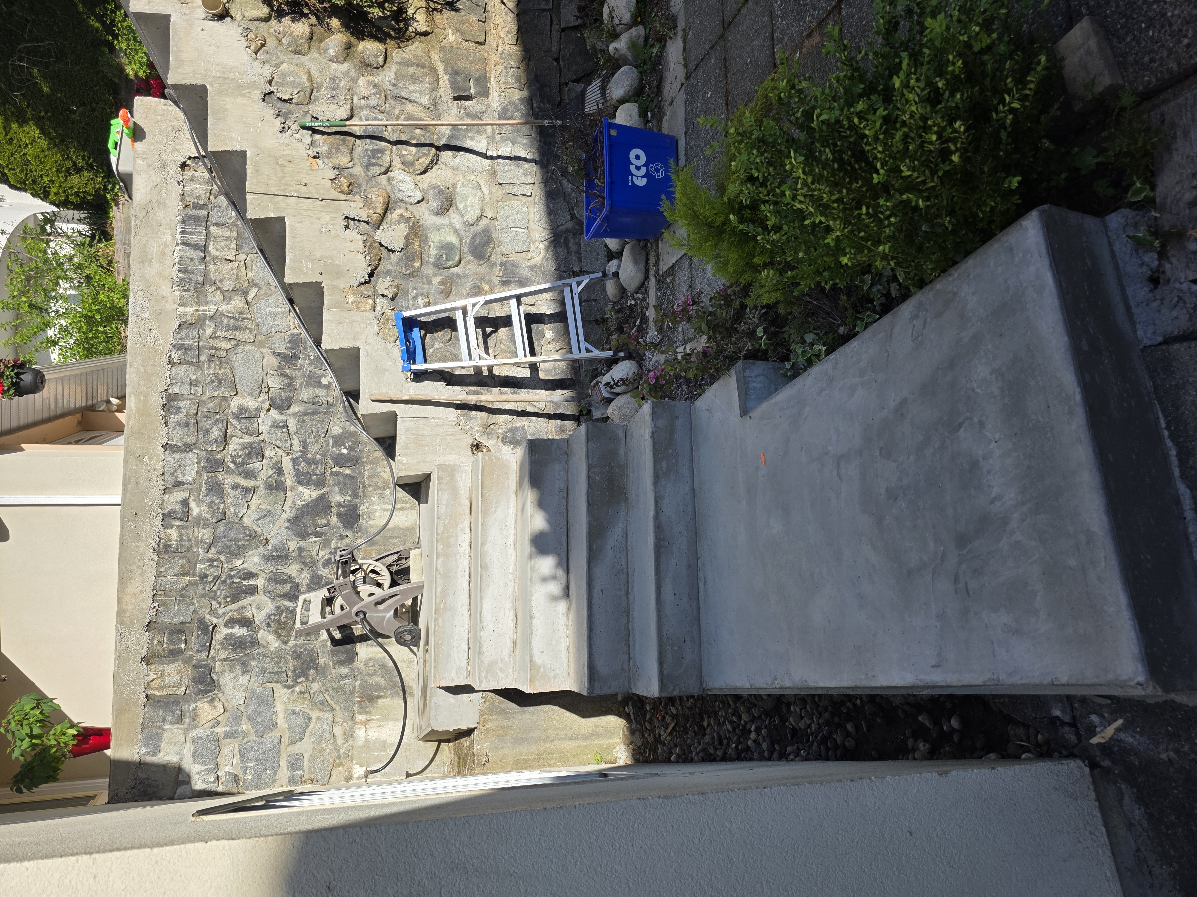 Mohamed's concrete stairs poured over old brick stairs by Tarak Construction