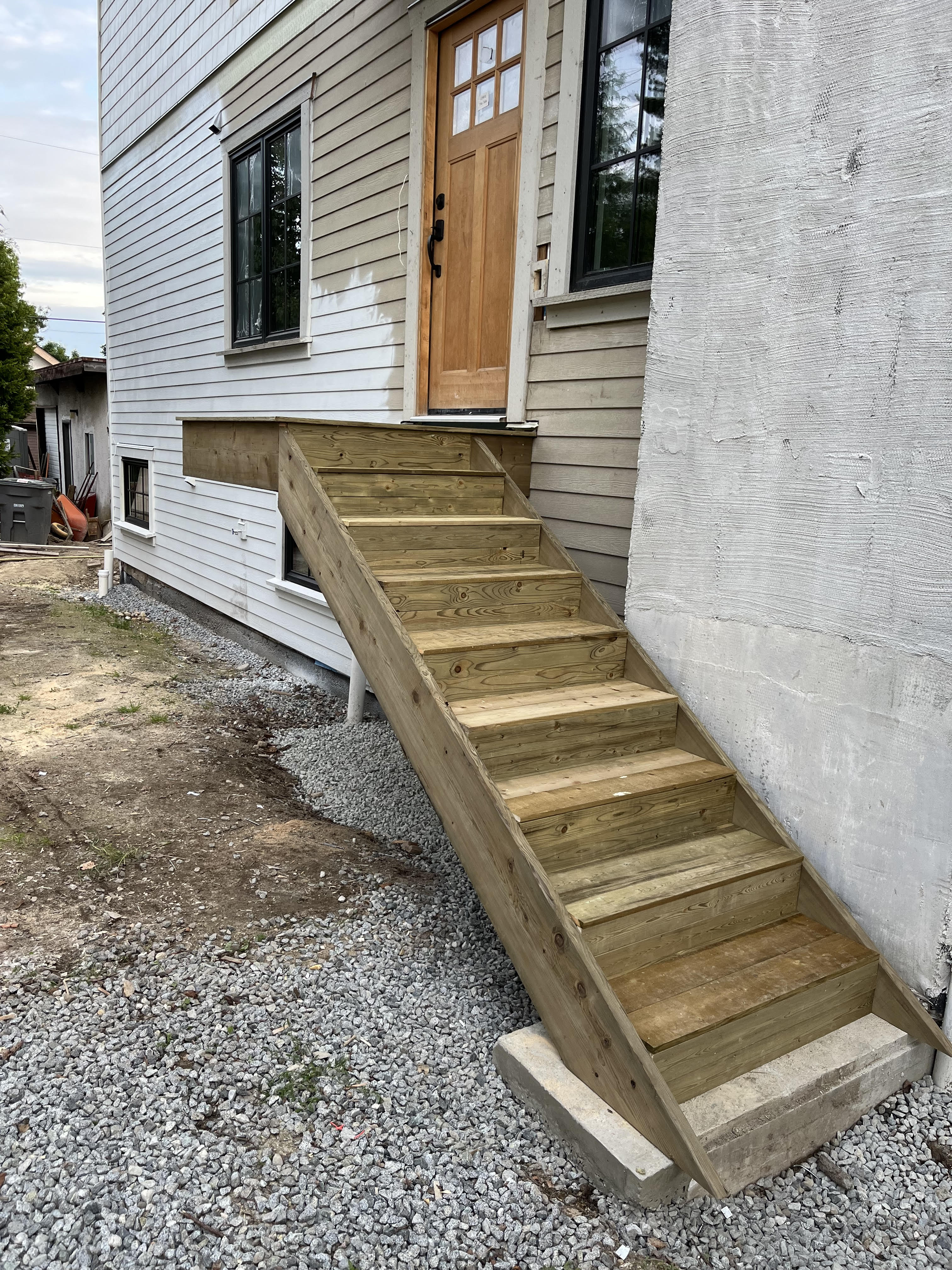 Michelle's side entrance stair framing on new home build by Tarak Construction