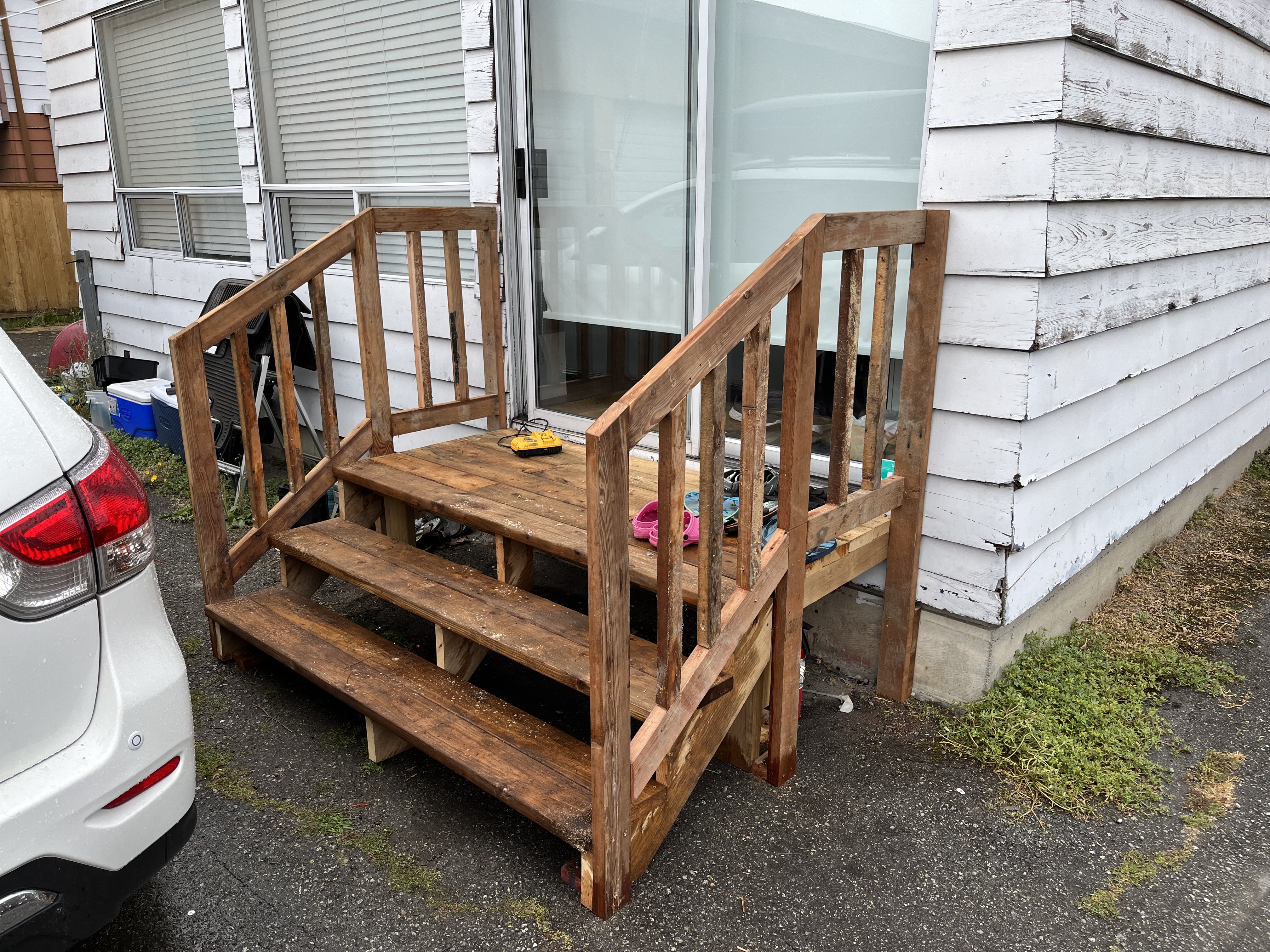 Jordan's back exit landing and stairs with handrails on both sides by Tarak Construction