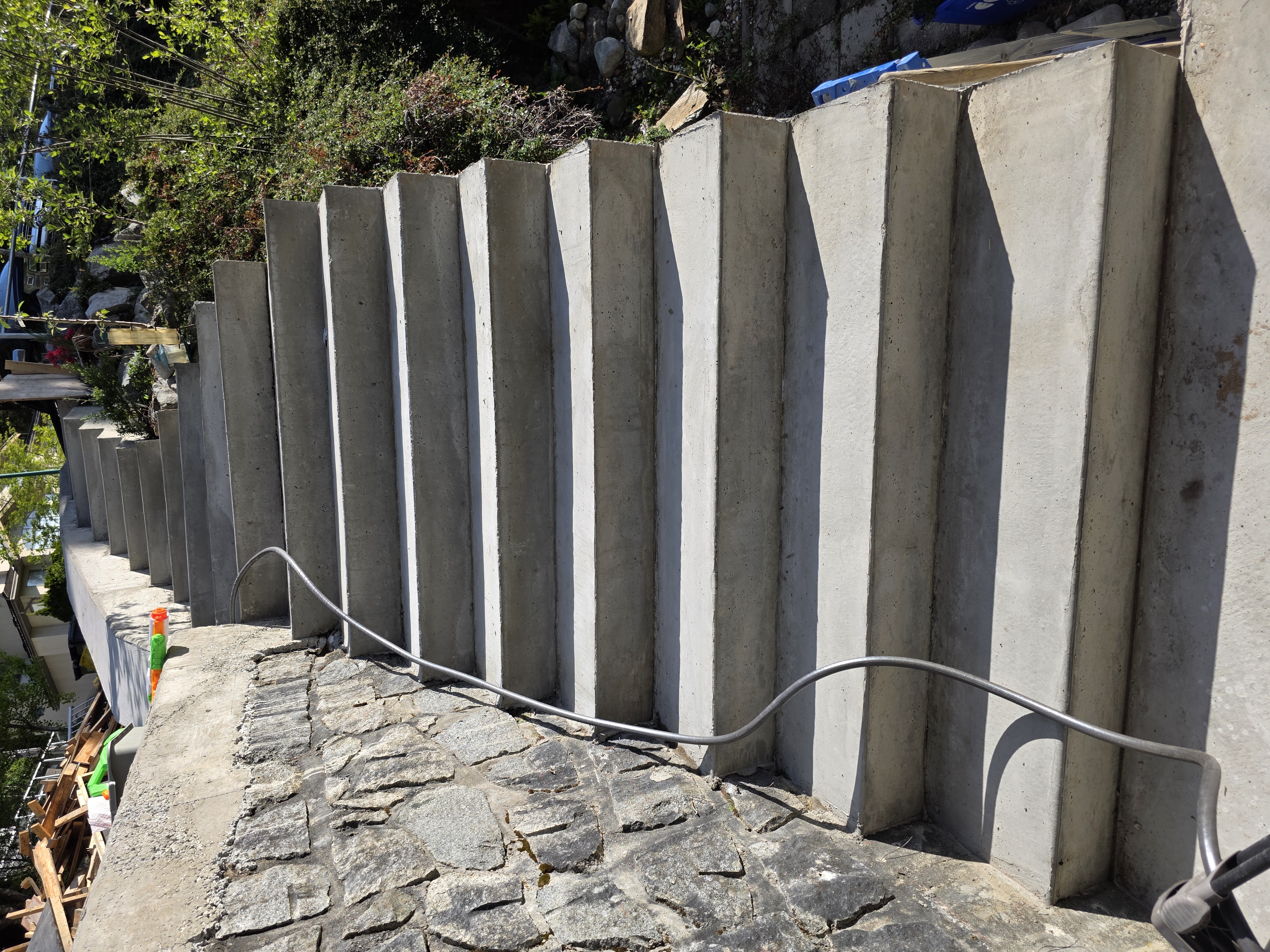 Mohamed's new concrete stairs with even risers and runs by Tarak Construction