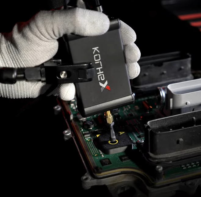 Korhex hardware being connected to an ECU