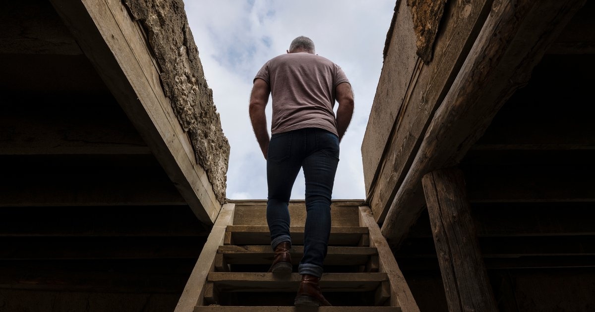A man ascending a staircase toward the light — the journey Beyond Discipline