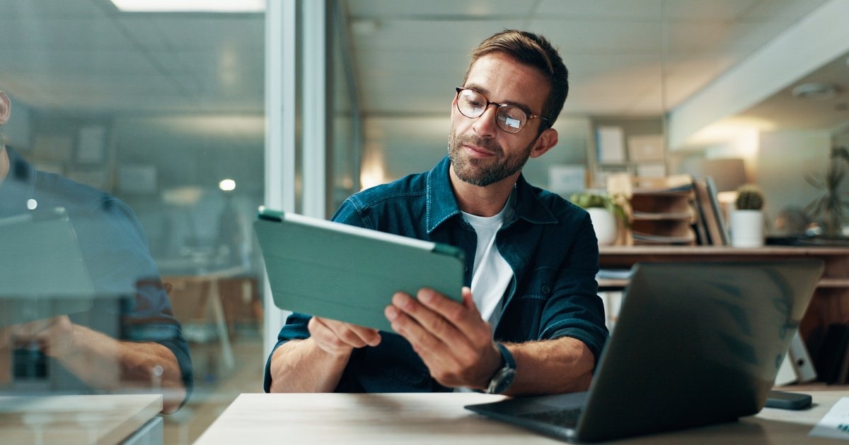 A man at his desk reviewing a message — a real person reads every note you send