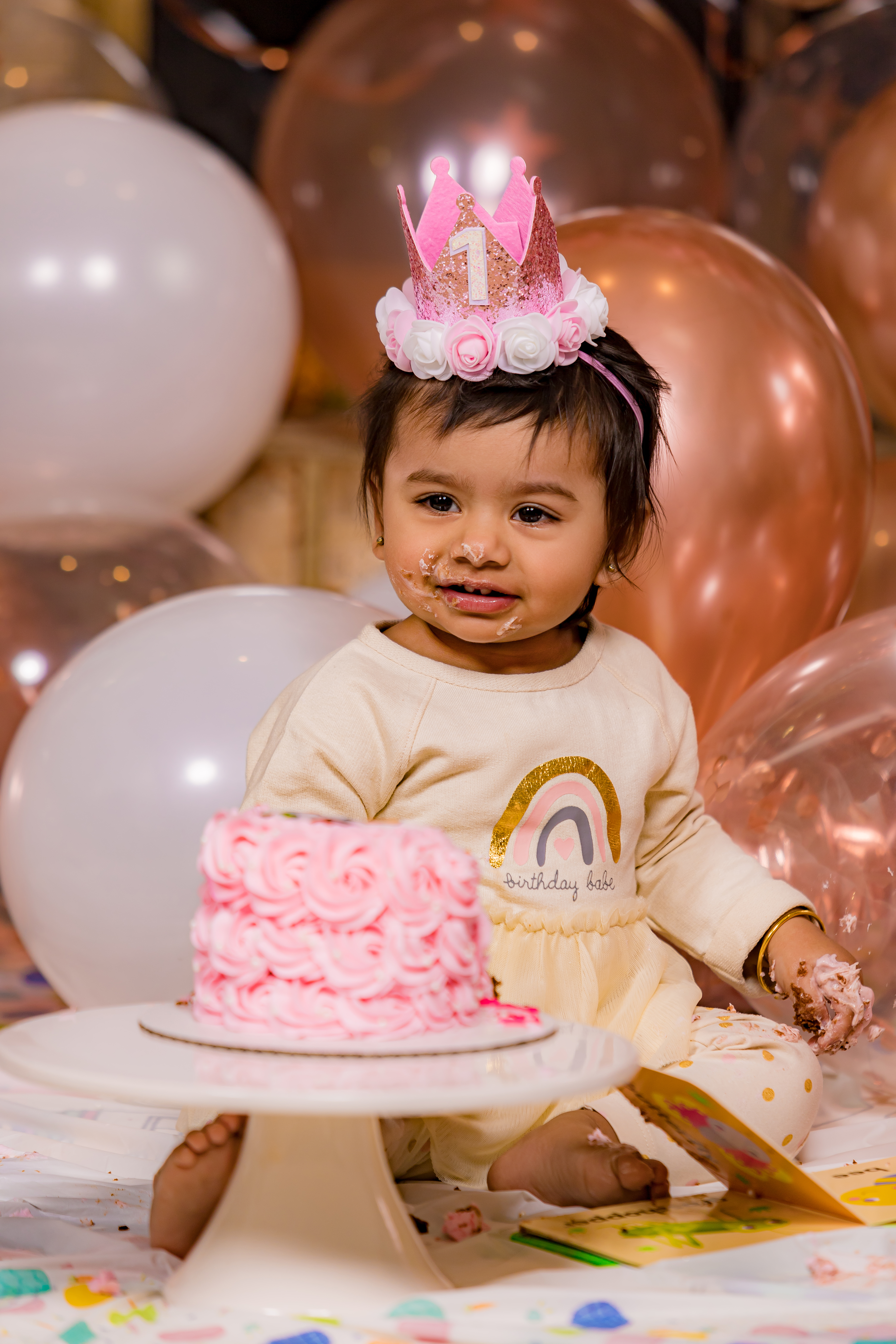 Baby with frosting on face smiling after first birthday cake smash — IDTPhoto Aurora IL