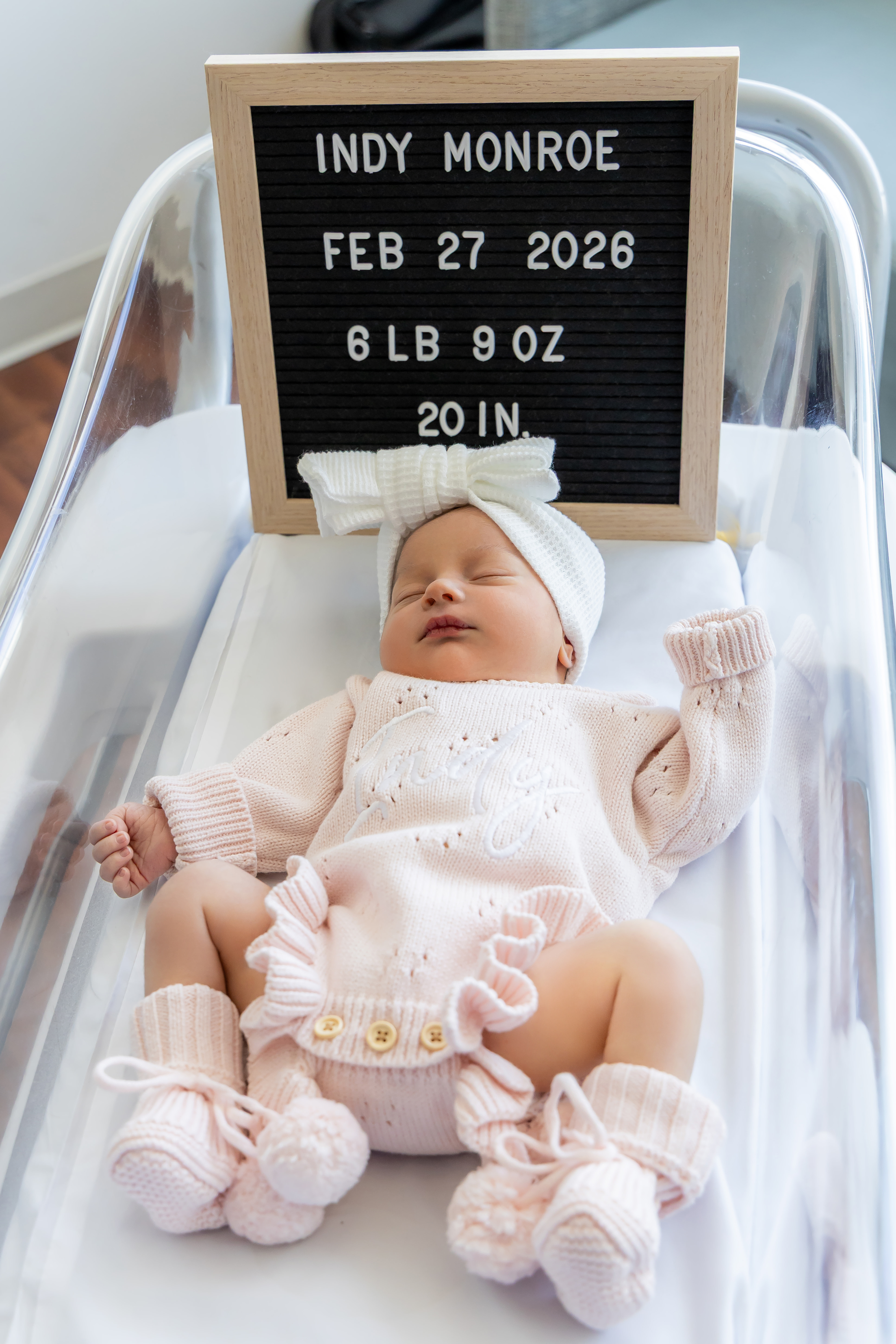 Fresh 48 — newborn Indy Monroe in hospital bassinet with birth announcement letter board