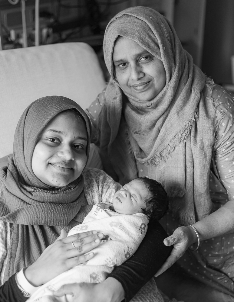 Fresh 48 black & white — new mom and grandmother with newborn Hayah in hospital room