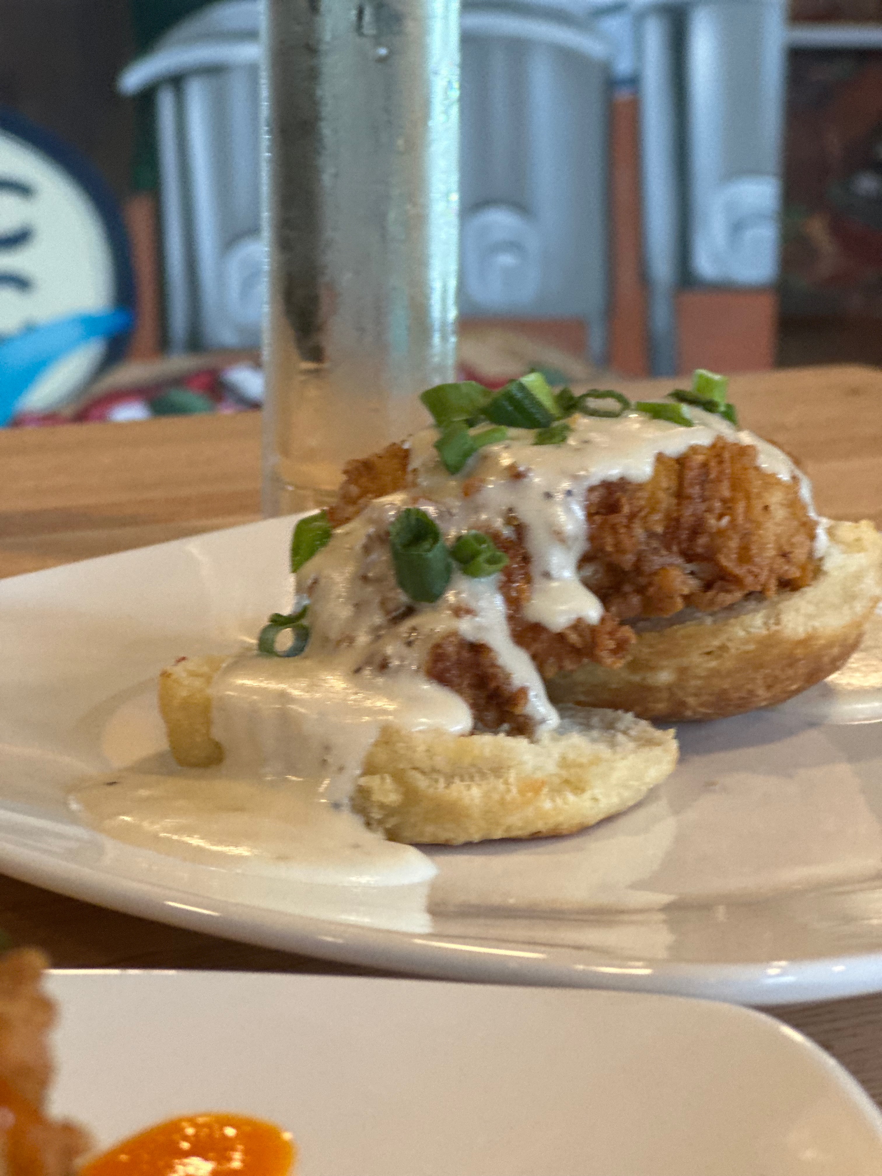 Fried chicken biscuit with cream gravy for Sunday brunch