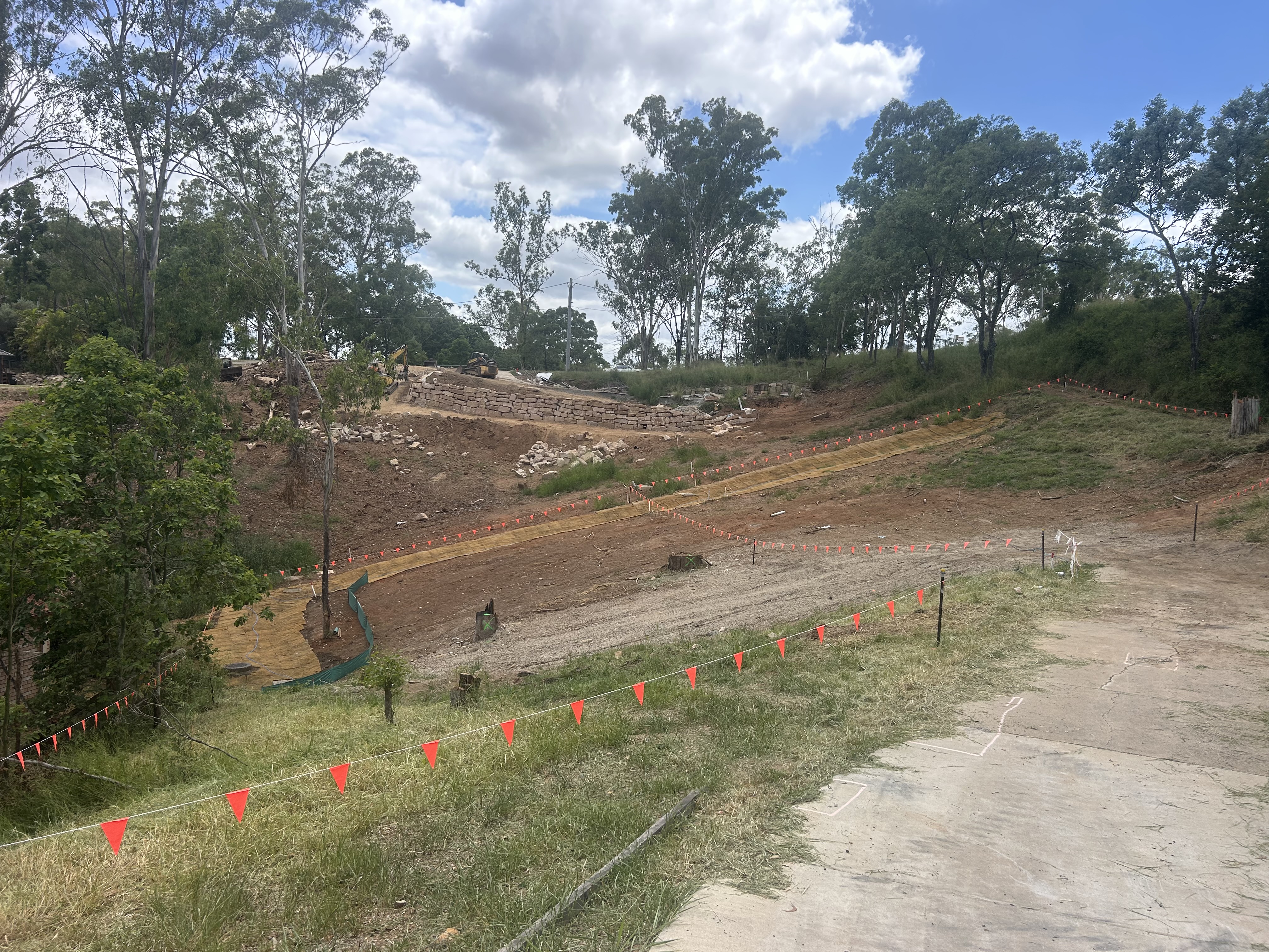 Site preparation earthworks with sediment controls and retaining wall construction in Brisbane