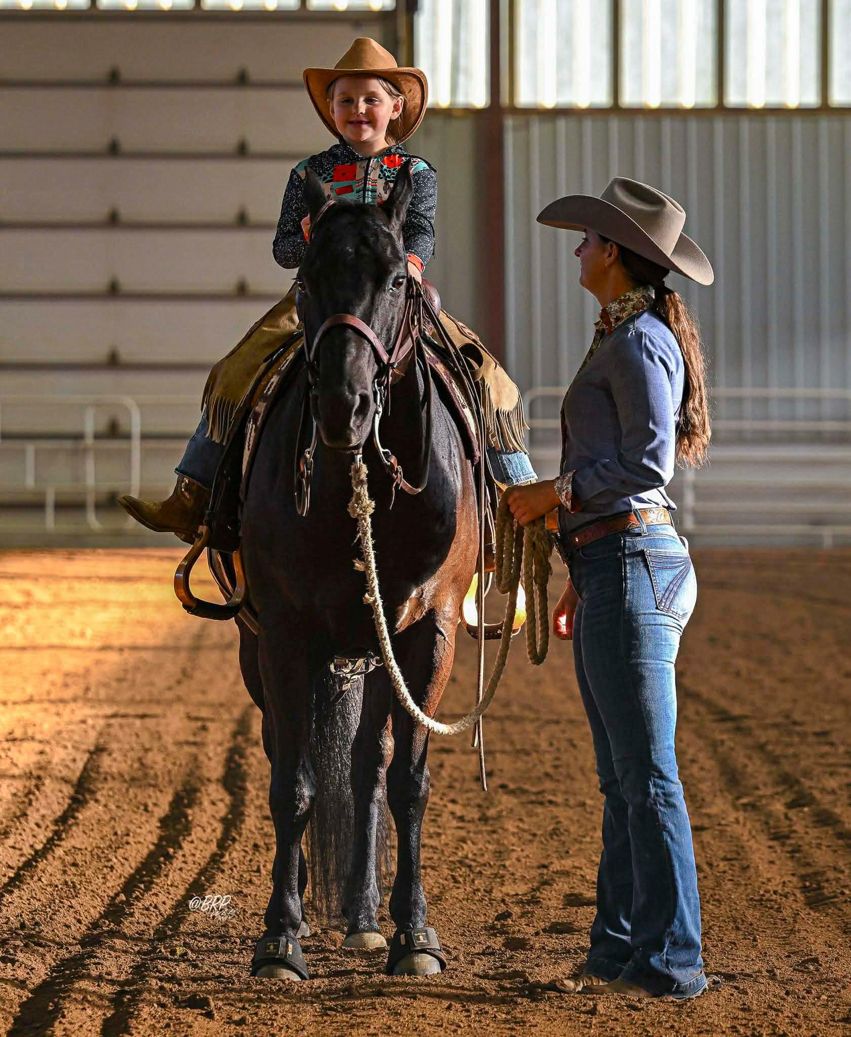 Pee Wee lesson with young rider on black horse