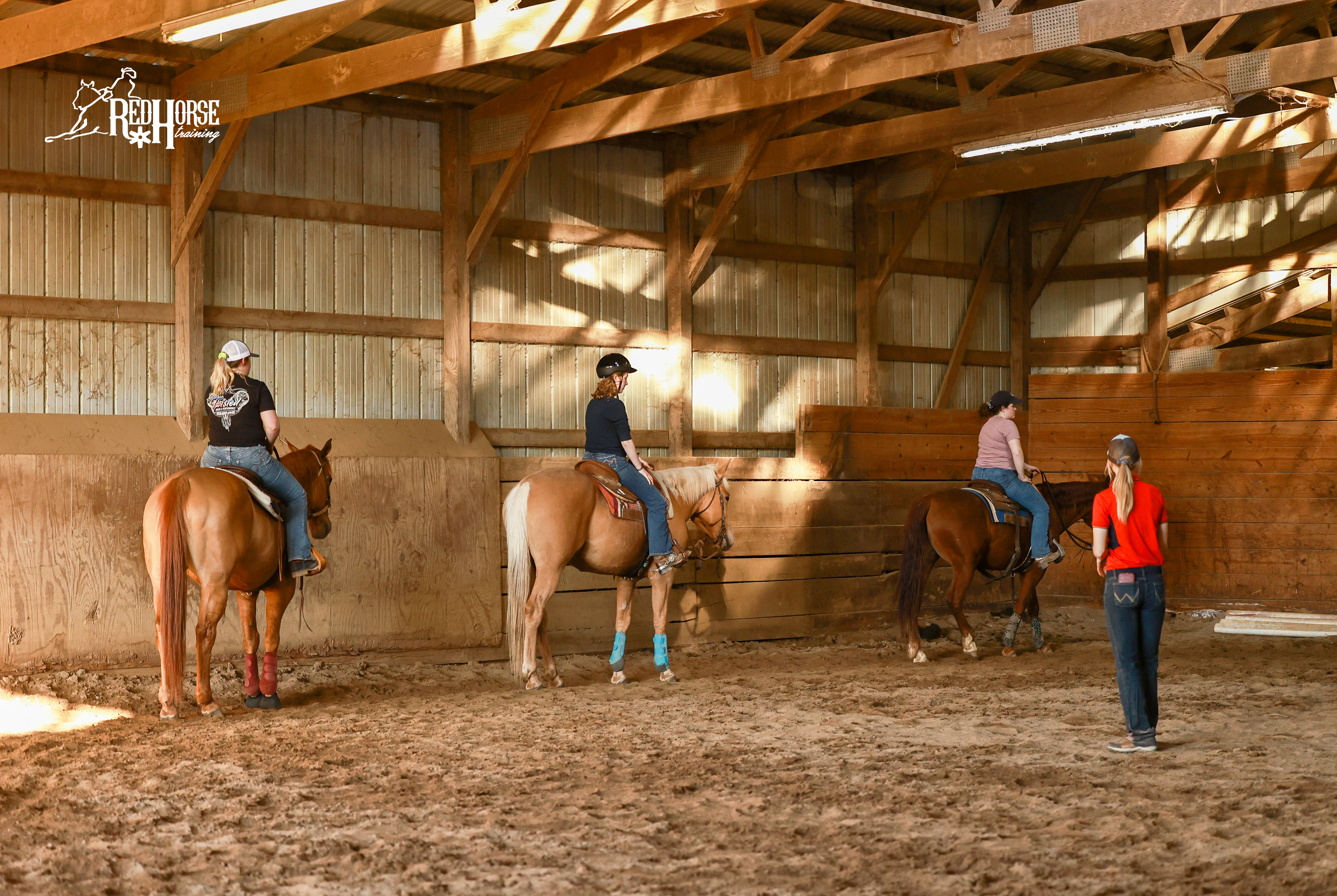 Group lesson in the indoor arena at Red Horse Training