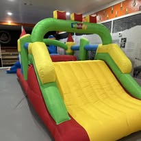 Colorful inflatable obstacle course inside the venue