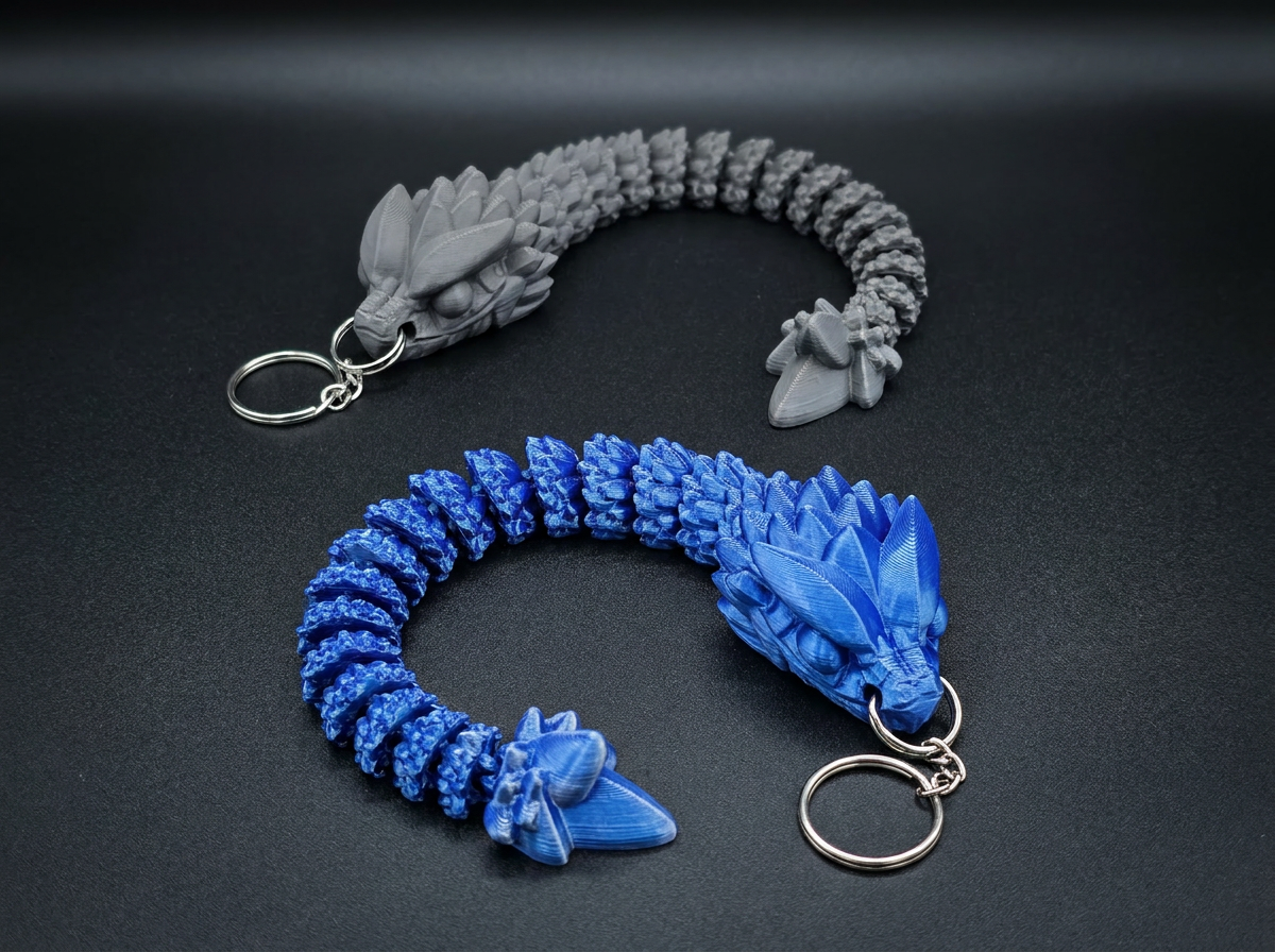 Dragon keychains — blue and grey articulated