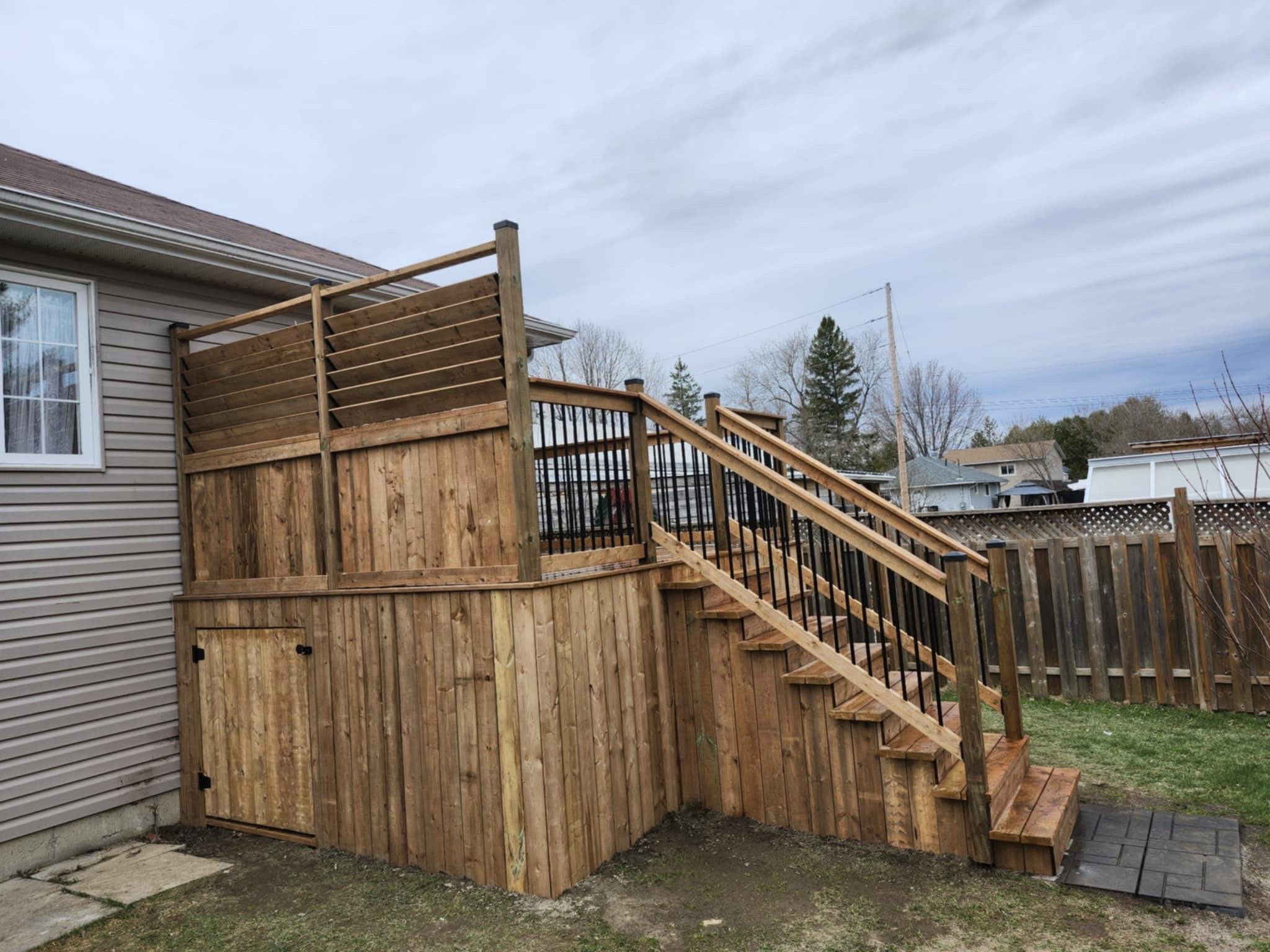 Custom elevated deck with privacy screen and storage