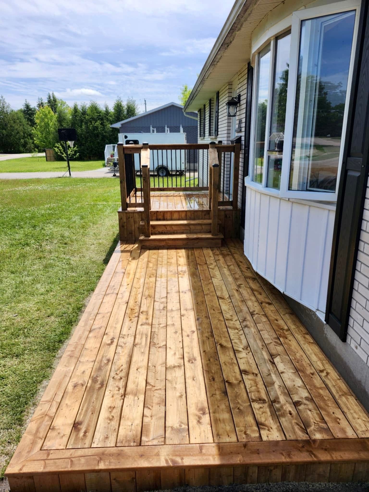 Wrap-around deck with railing and steps