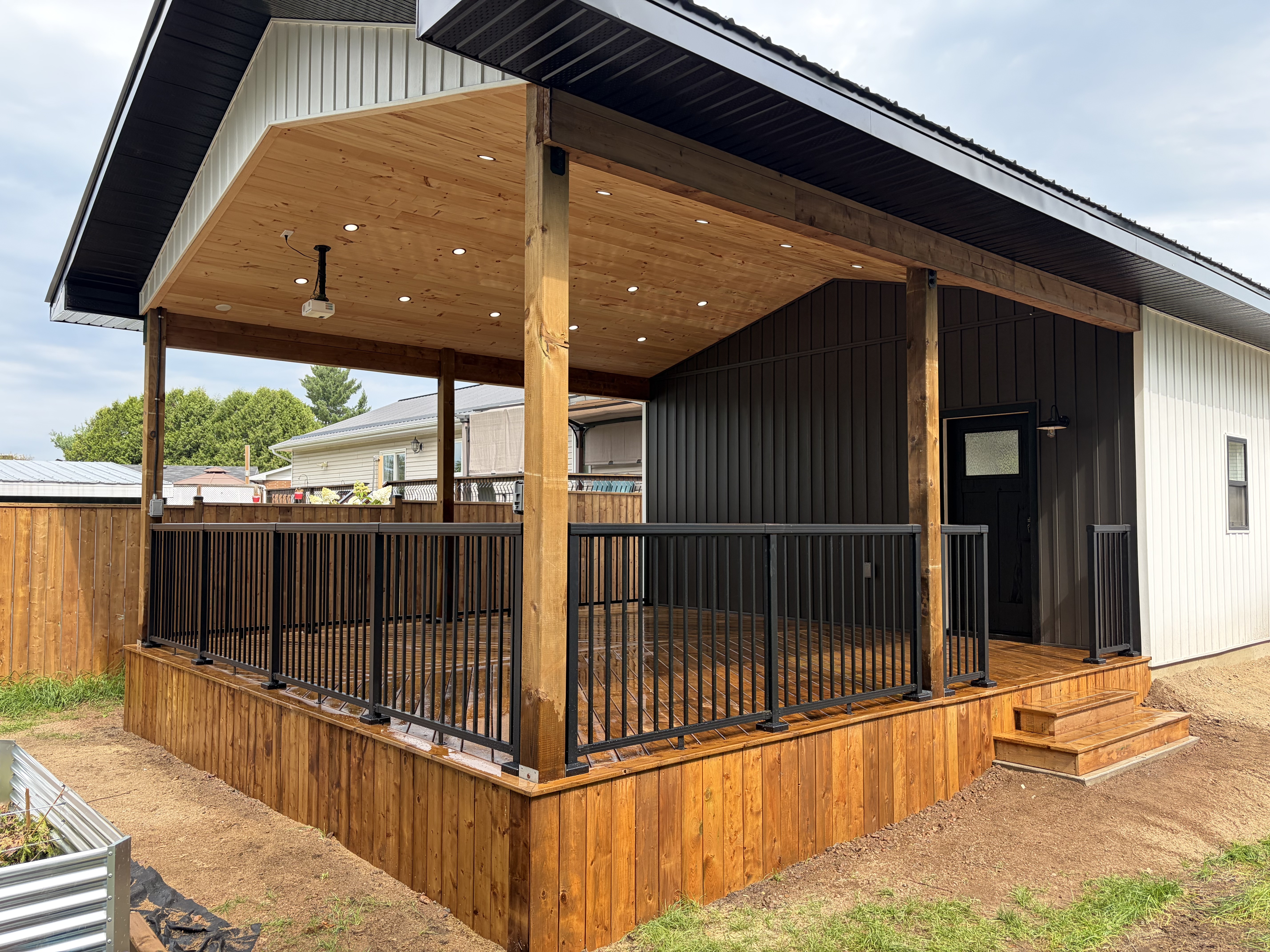 Garage covered deck corner view with pot lights