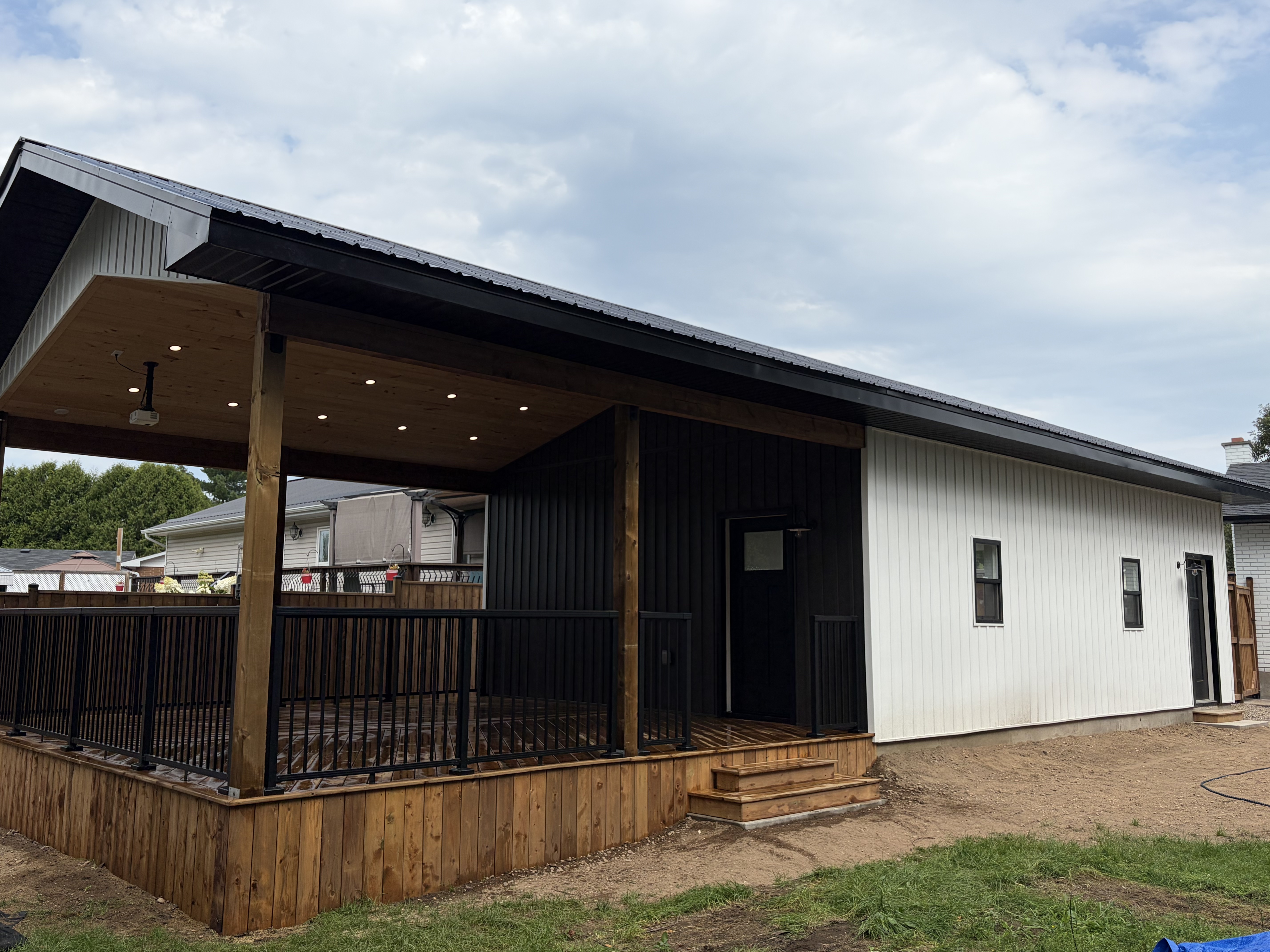 Full garage and covered deck wide angle view
